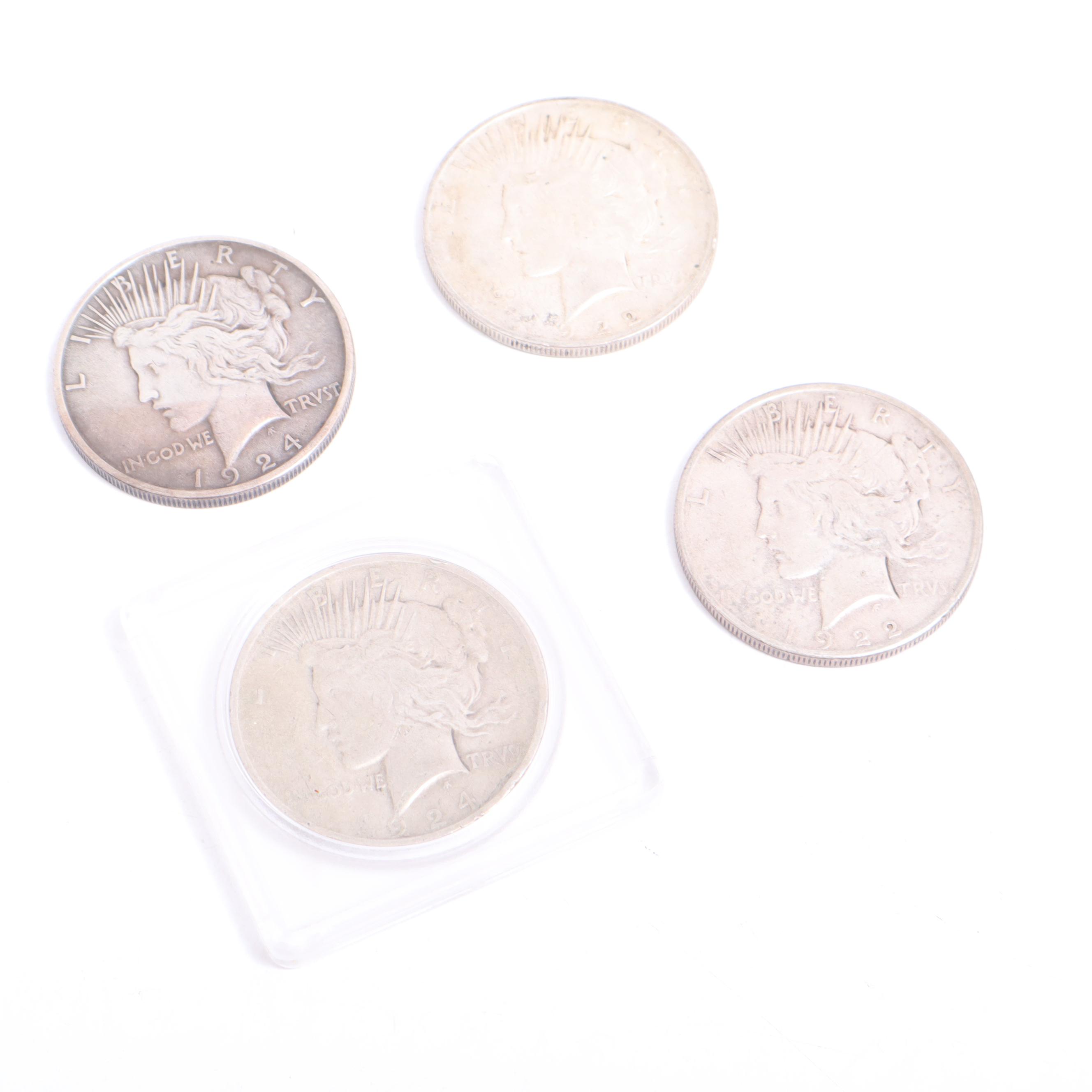 1922-S, 1922-D, and Two 1924 Peace Silver Dollars