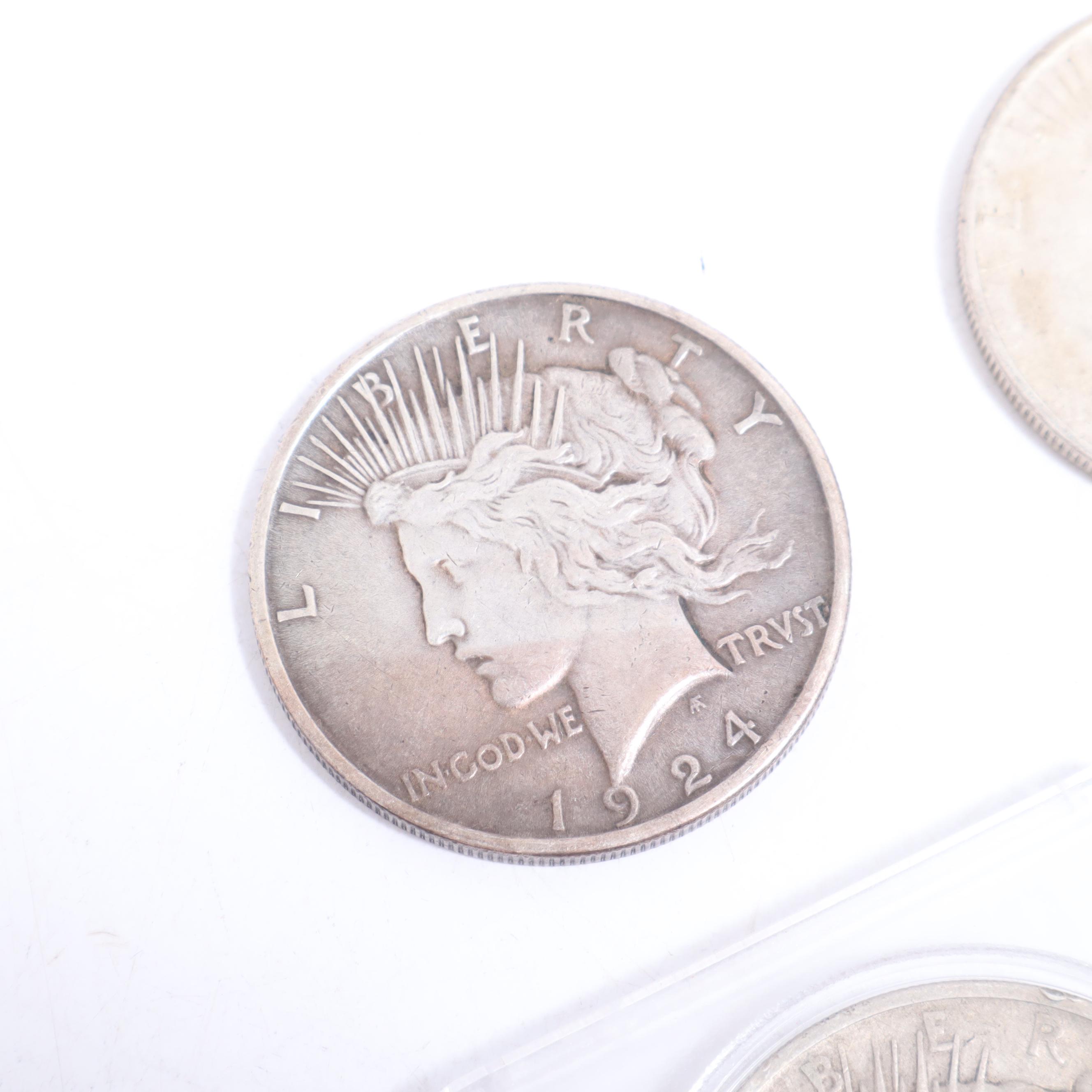 1922-S, 1922-D, and Two 1924 Peace Silver Dollars
