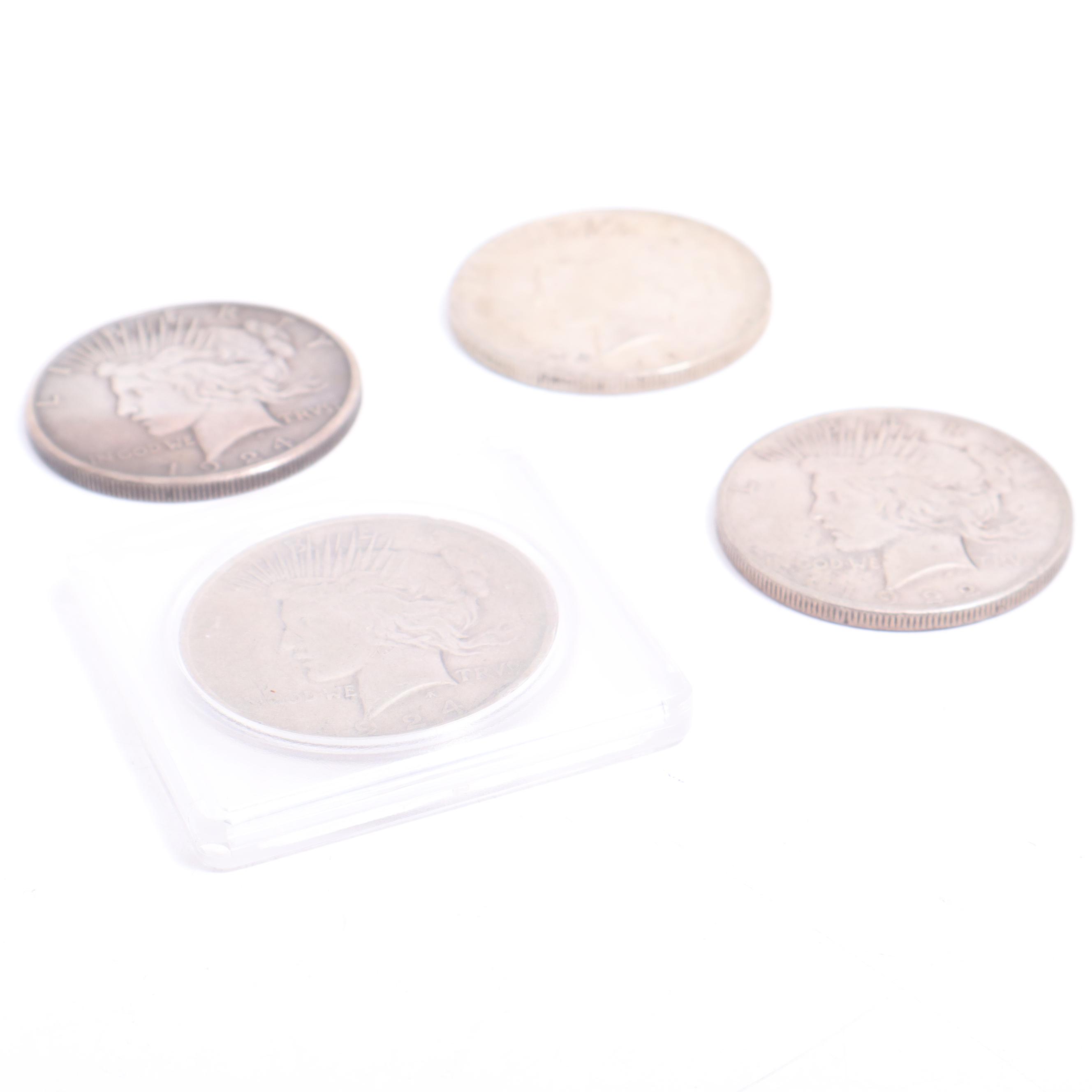 1922-S, 1922-D, and Two 1924 Peace Silver Dollars
