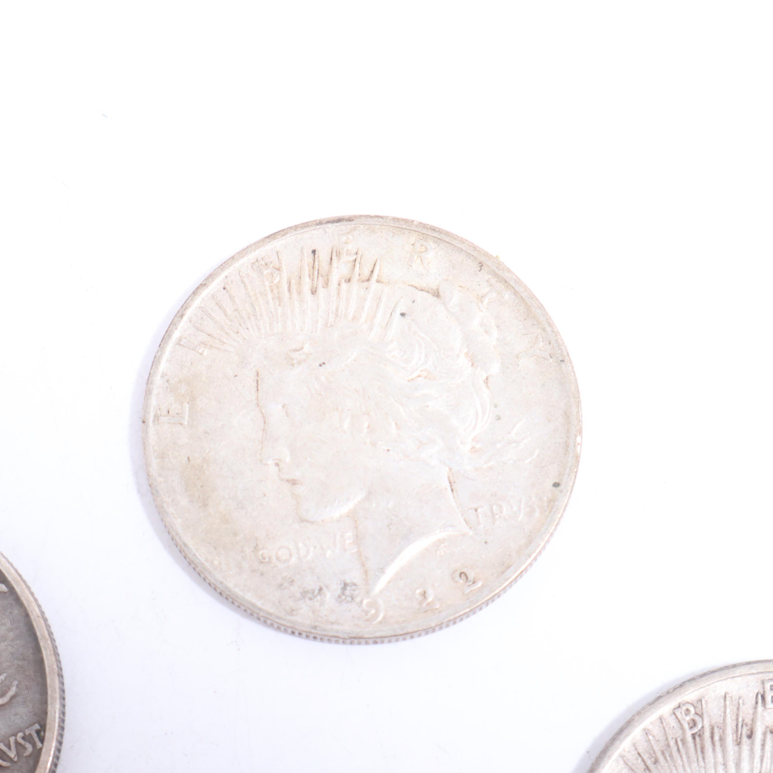 1922-S, 1922-D, and Two 1924 Peace Silver Dollars