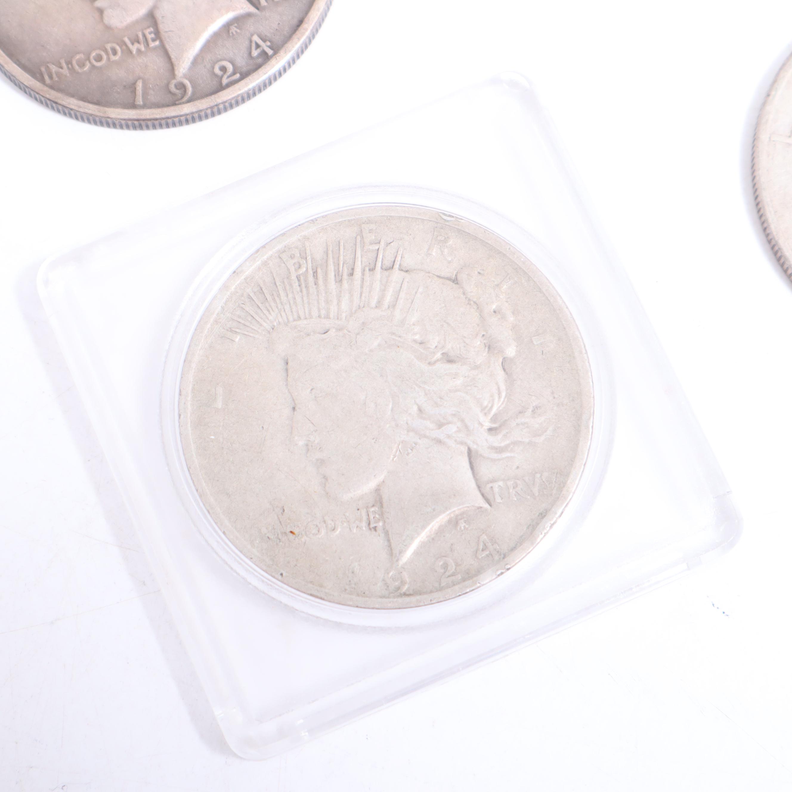 1922-S, 1922-D, and Two 1924 Peace Silver Dollars
