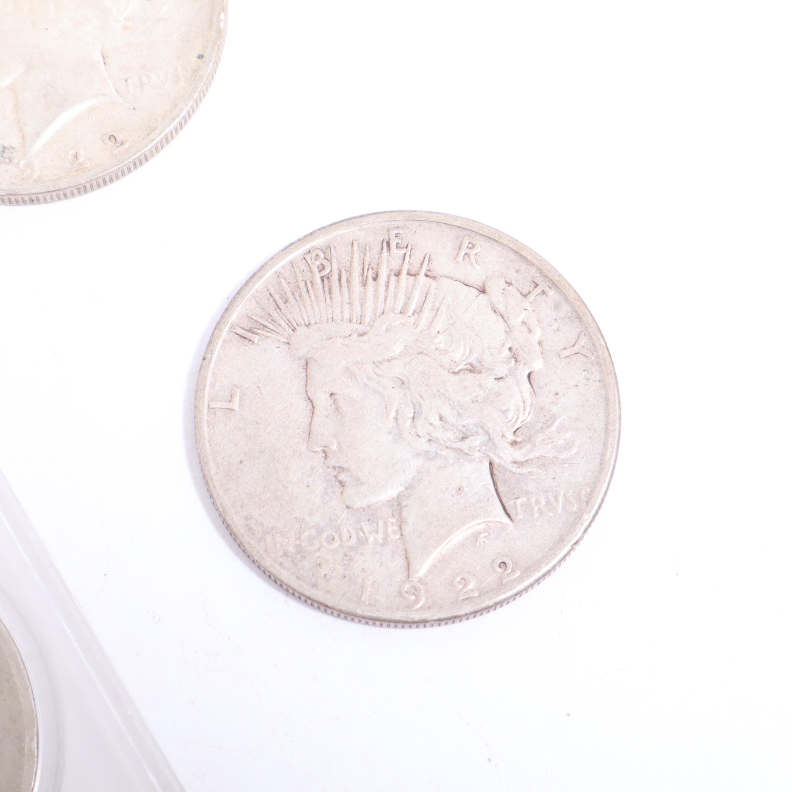1922-S, 1922-D, and Two 1924 Peace Silver Dollars