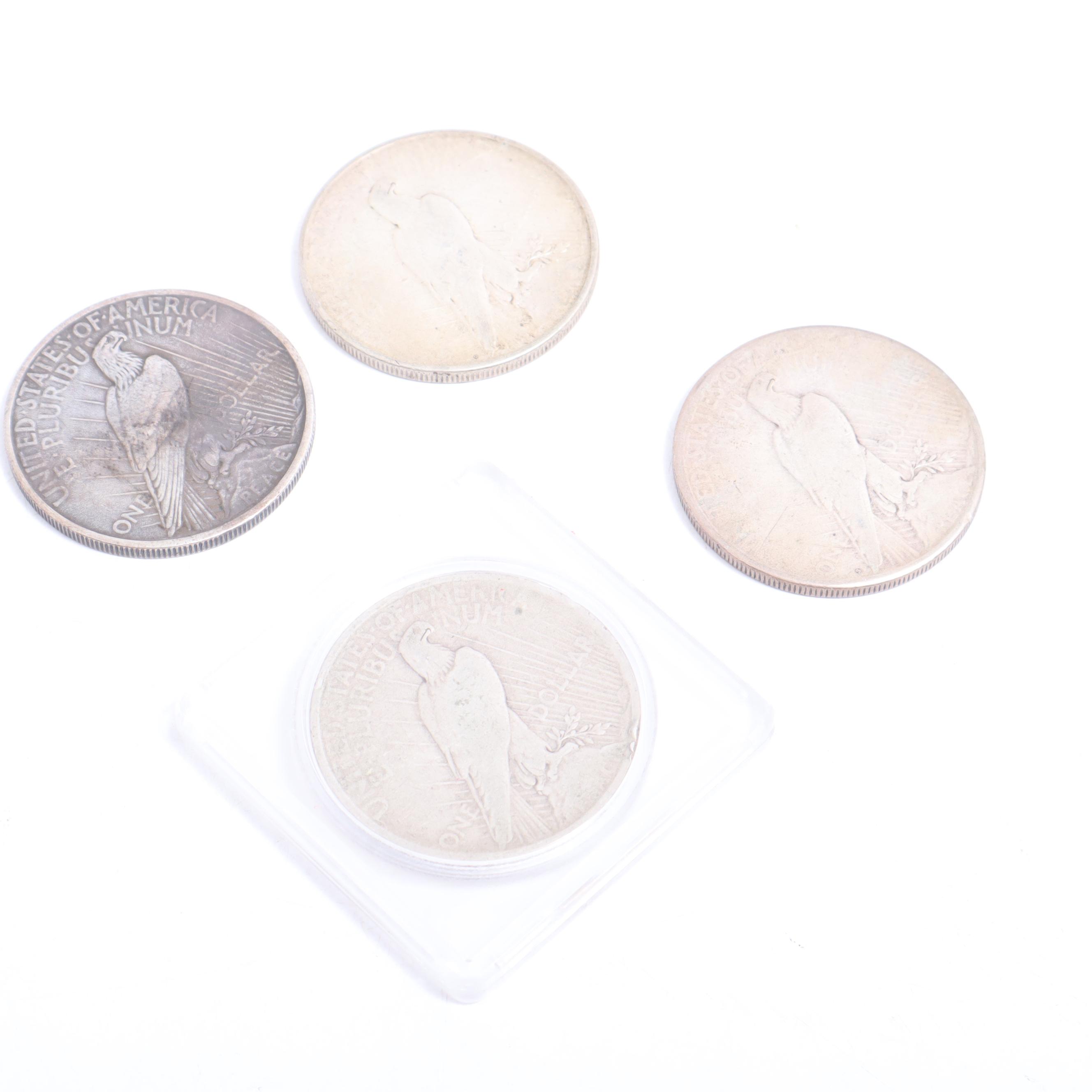 1922-S, 1922-D, and Two 1924 Peace Silver Dollars