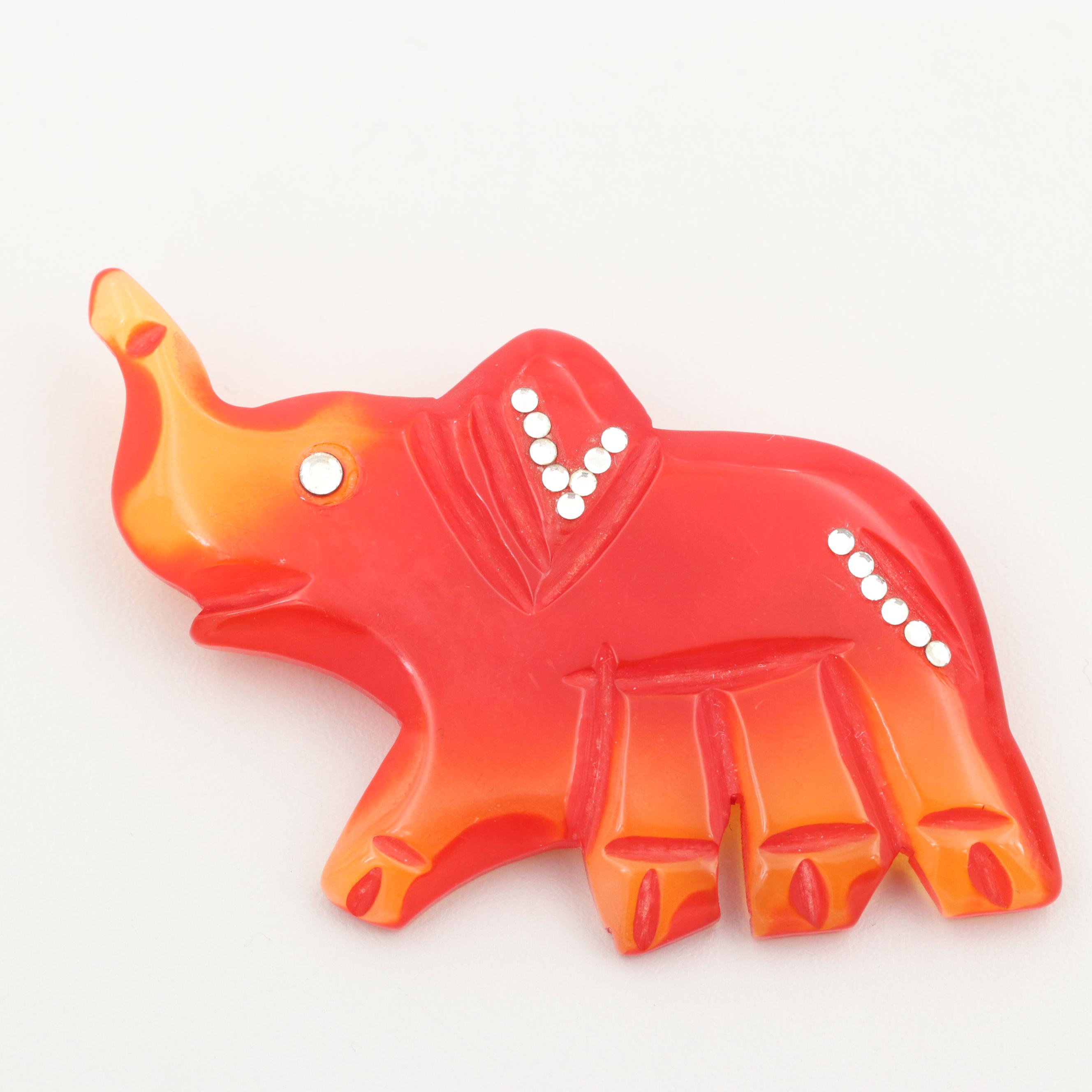 Vintage Gold Tone Glass and Tomato Bakelite Carved Elephant Brooch