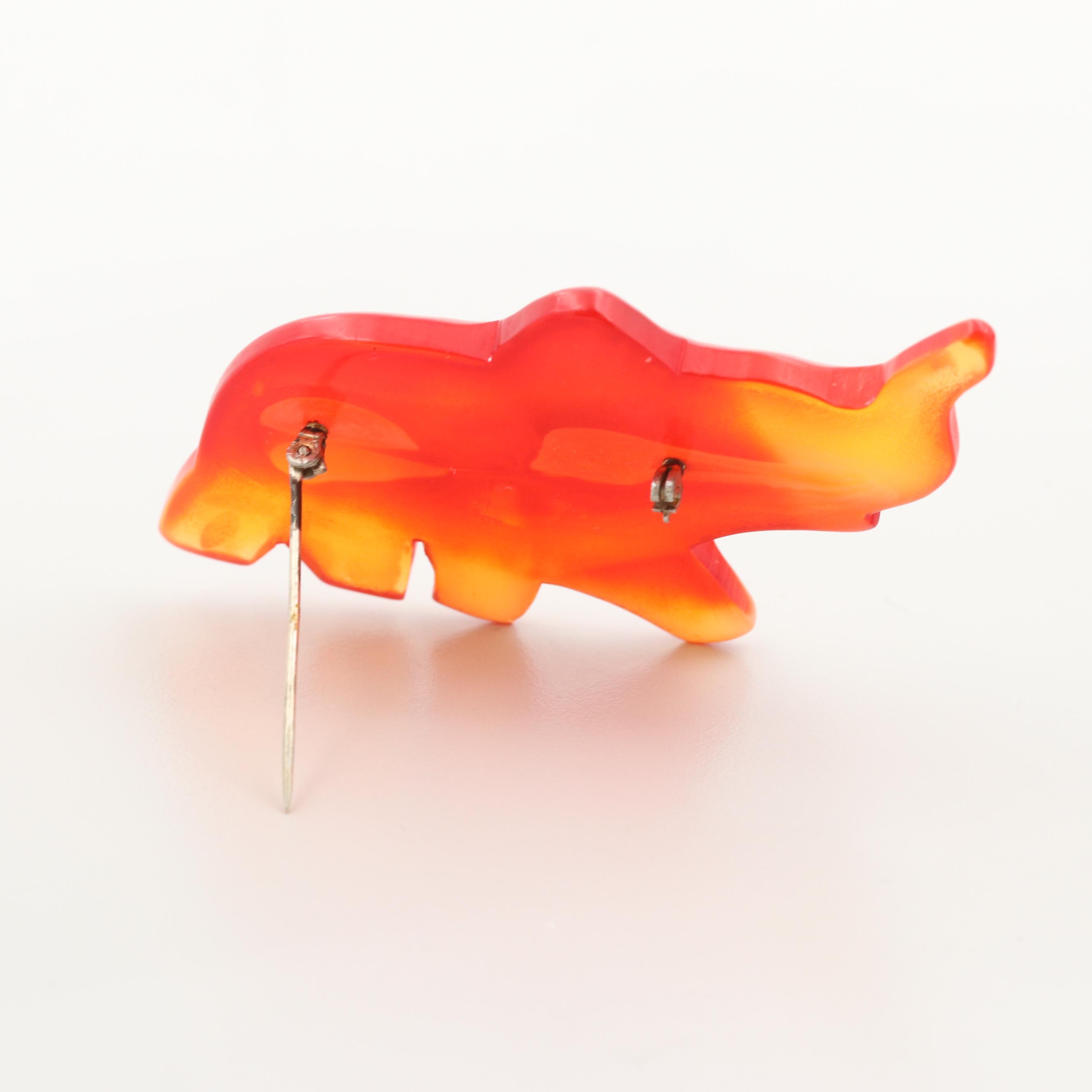 Vintage Gold Tone Glass and Tomato Bakelite Carved Elephant Brooch