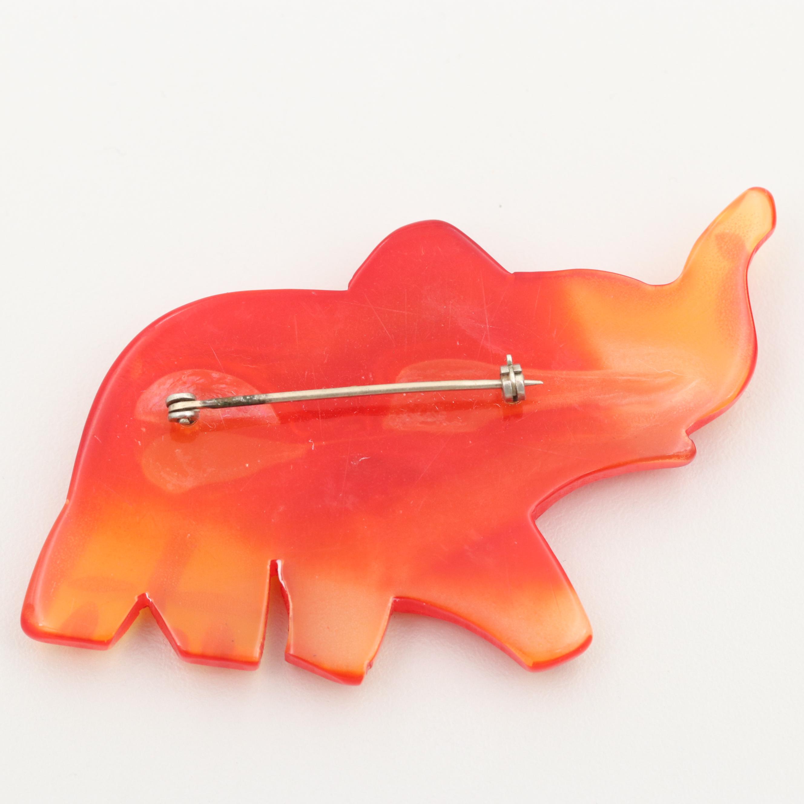 Vintage Gold Tone Glass and Tomato Bakelite Carved Elephant Brooch
