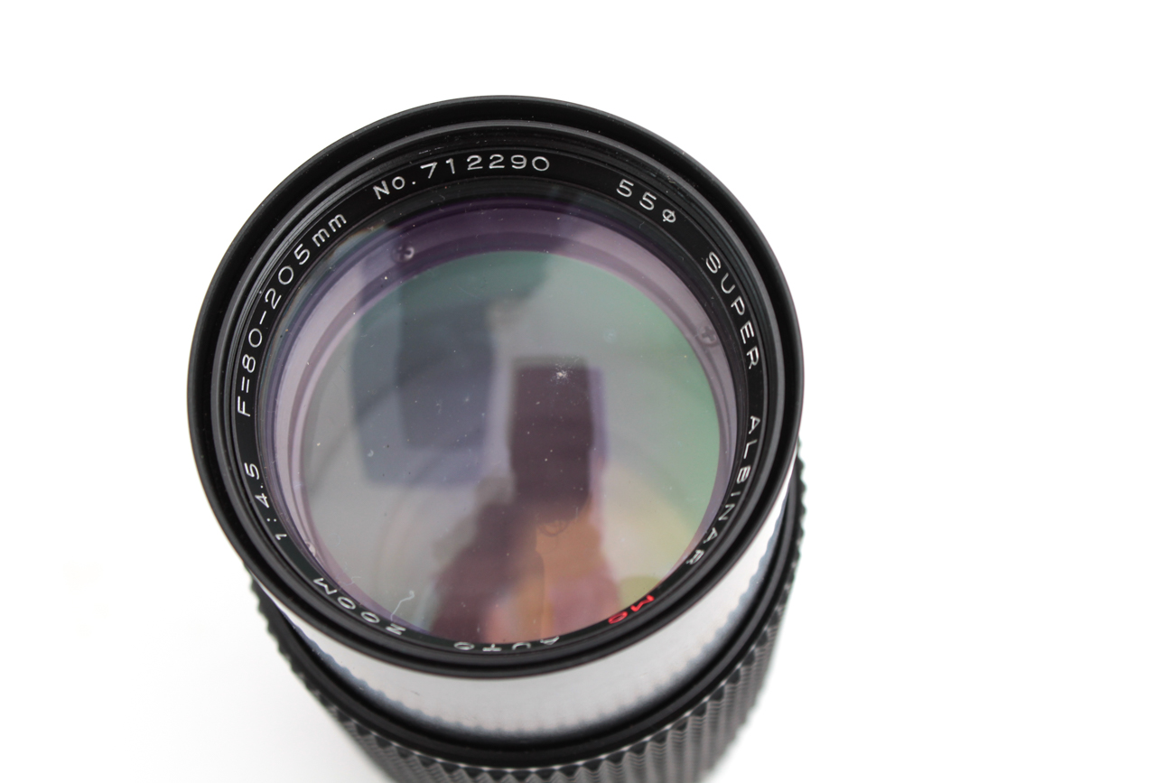 Canon AE-1 35mm SLR Camera, Super Albinar Lens, and Leather Camera Bag