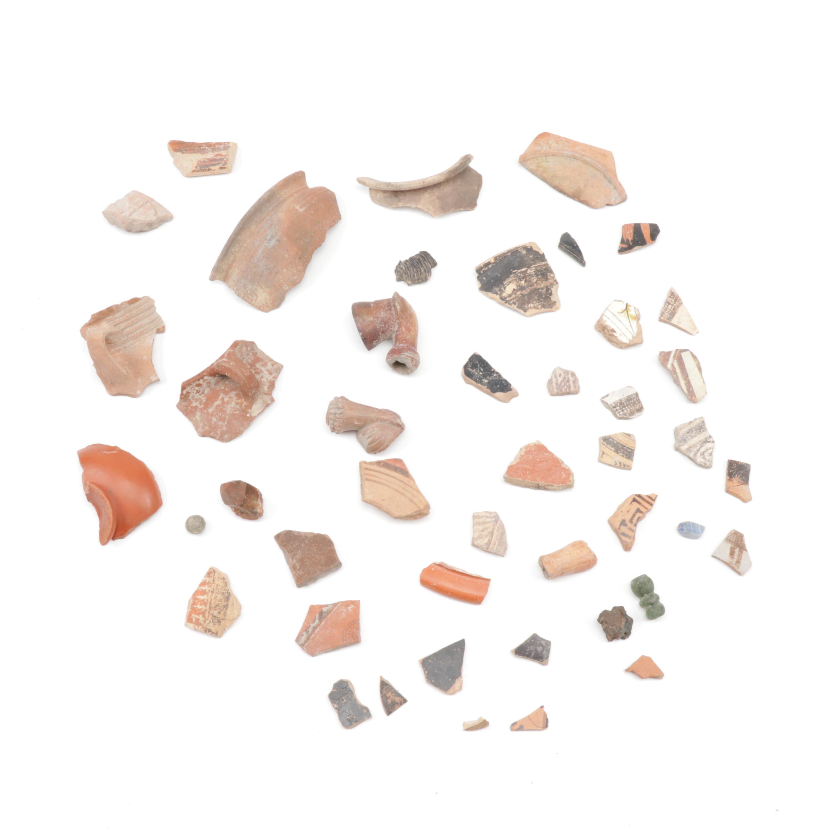 Antique Greco-Roman-Style Potsherds and Pipe Heads