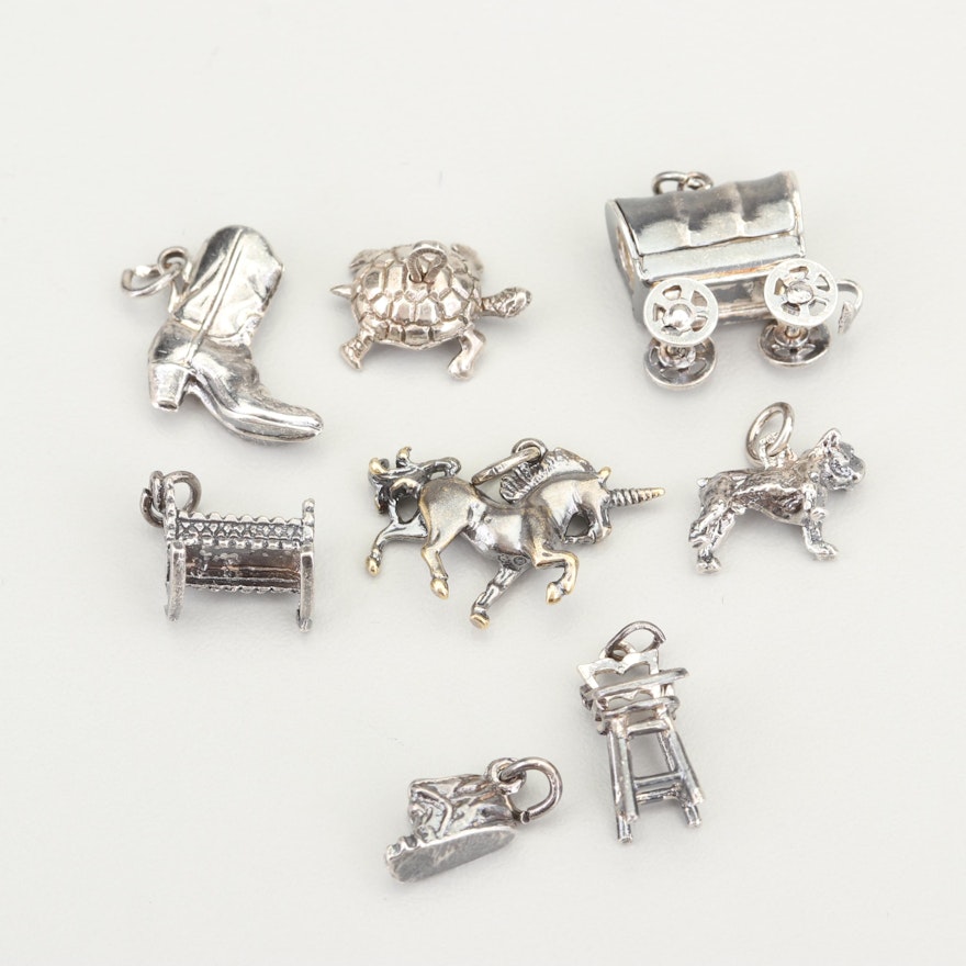 Eight Sterling Silver Charms