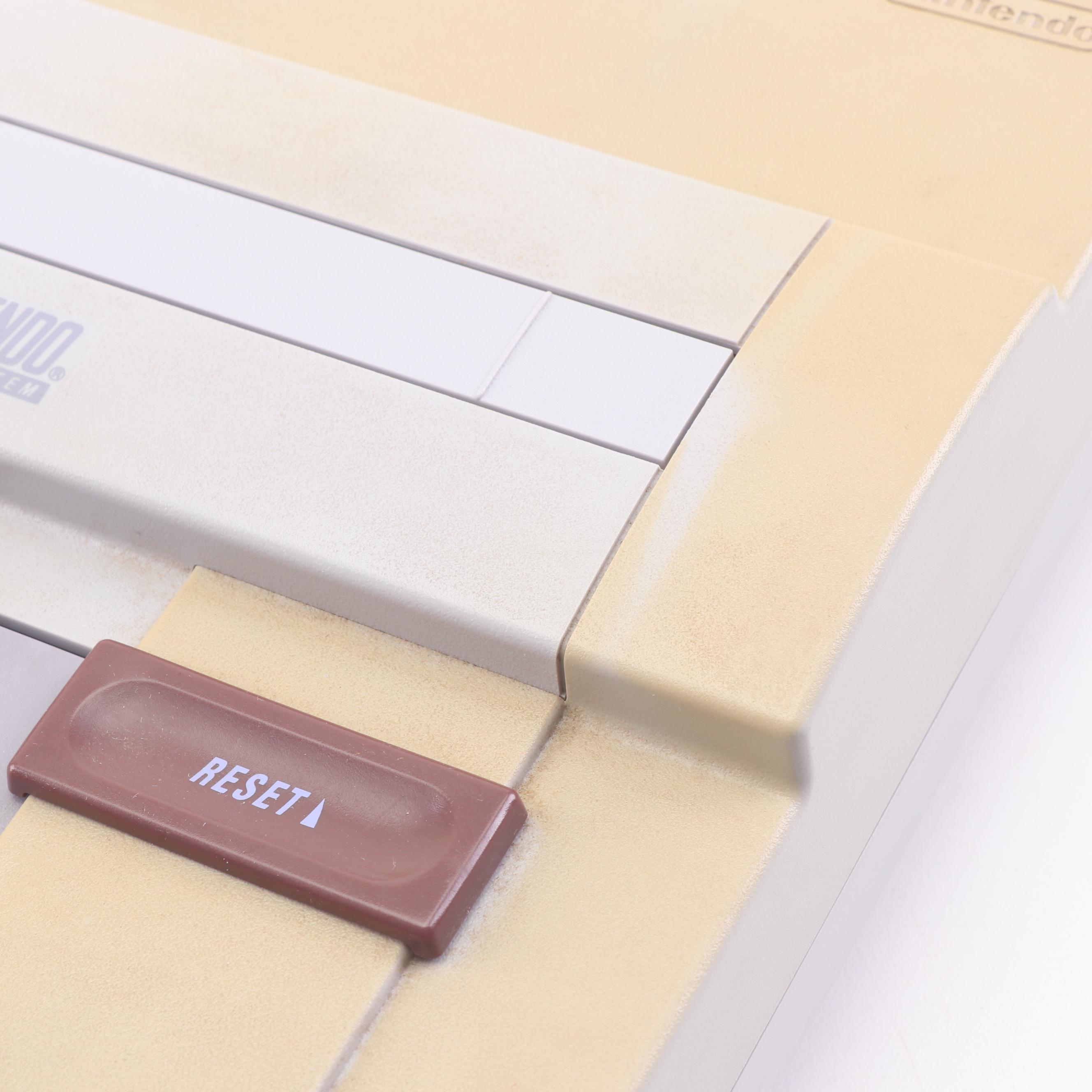 Super Nintendo Gaming Console Model SNS-001 and Game Cartridges