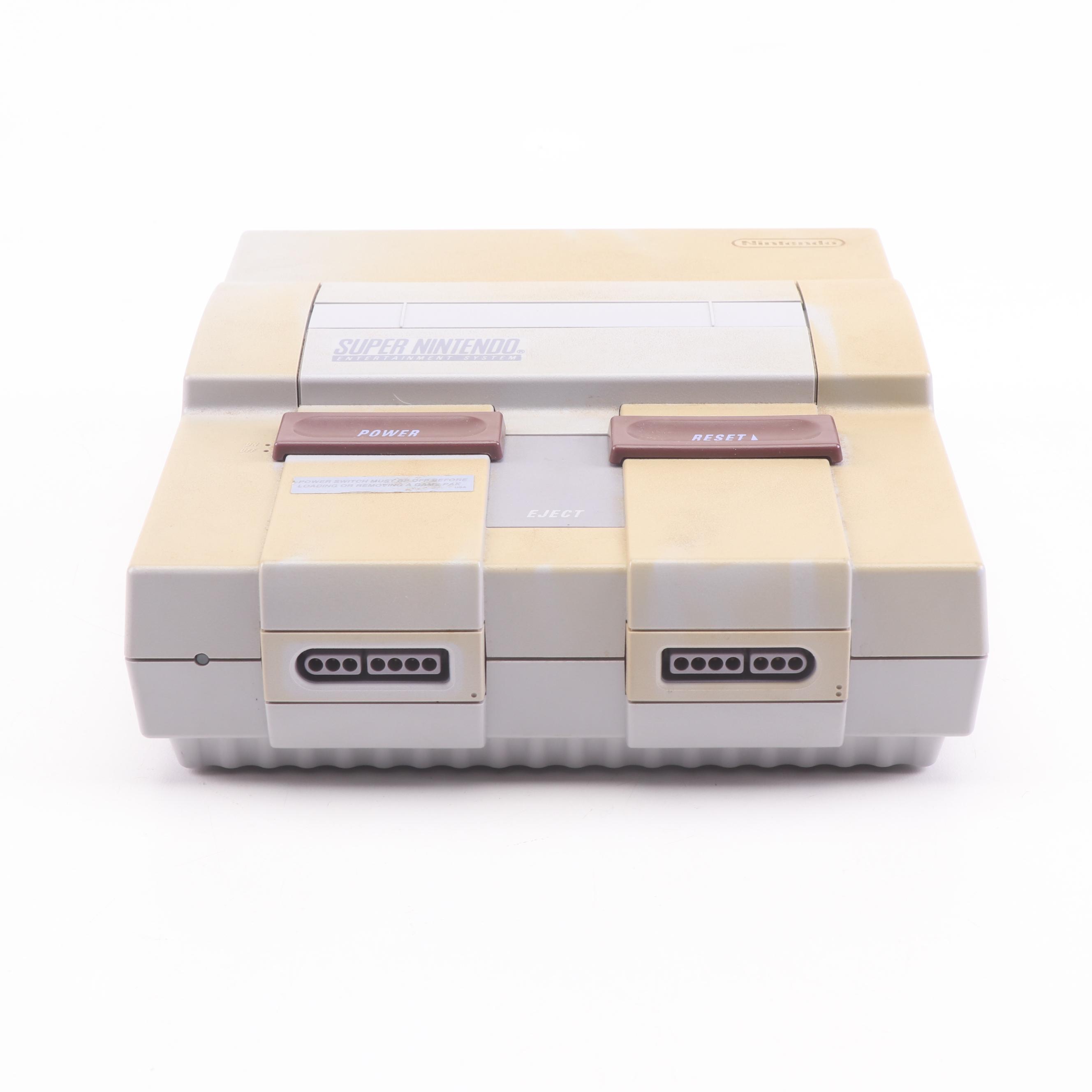 Super Nintendo Gaming Console Model SNS-001 and Game Cartridges