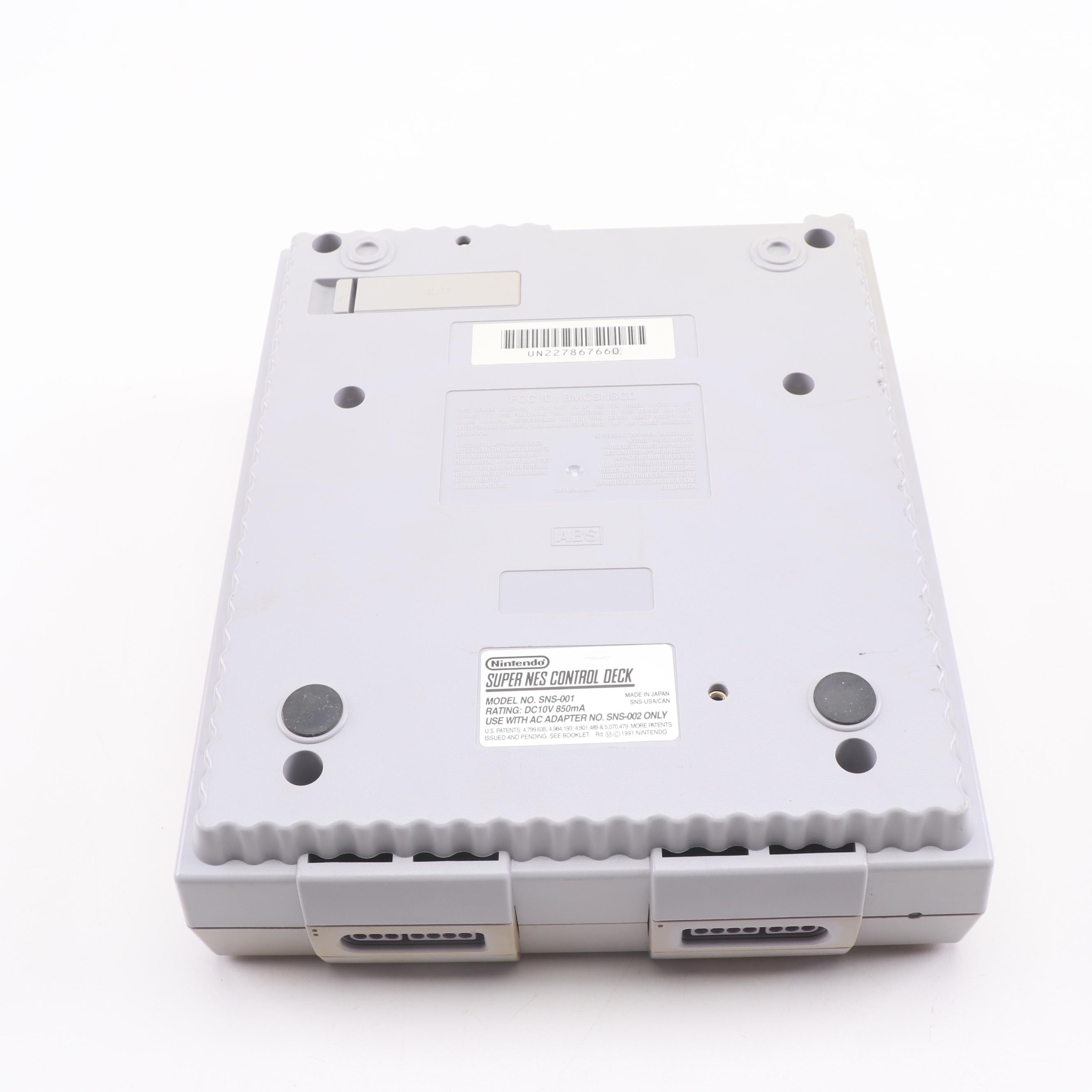 Super Nintendo Gaming Console Model SNS-001 and Game Cartridges