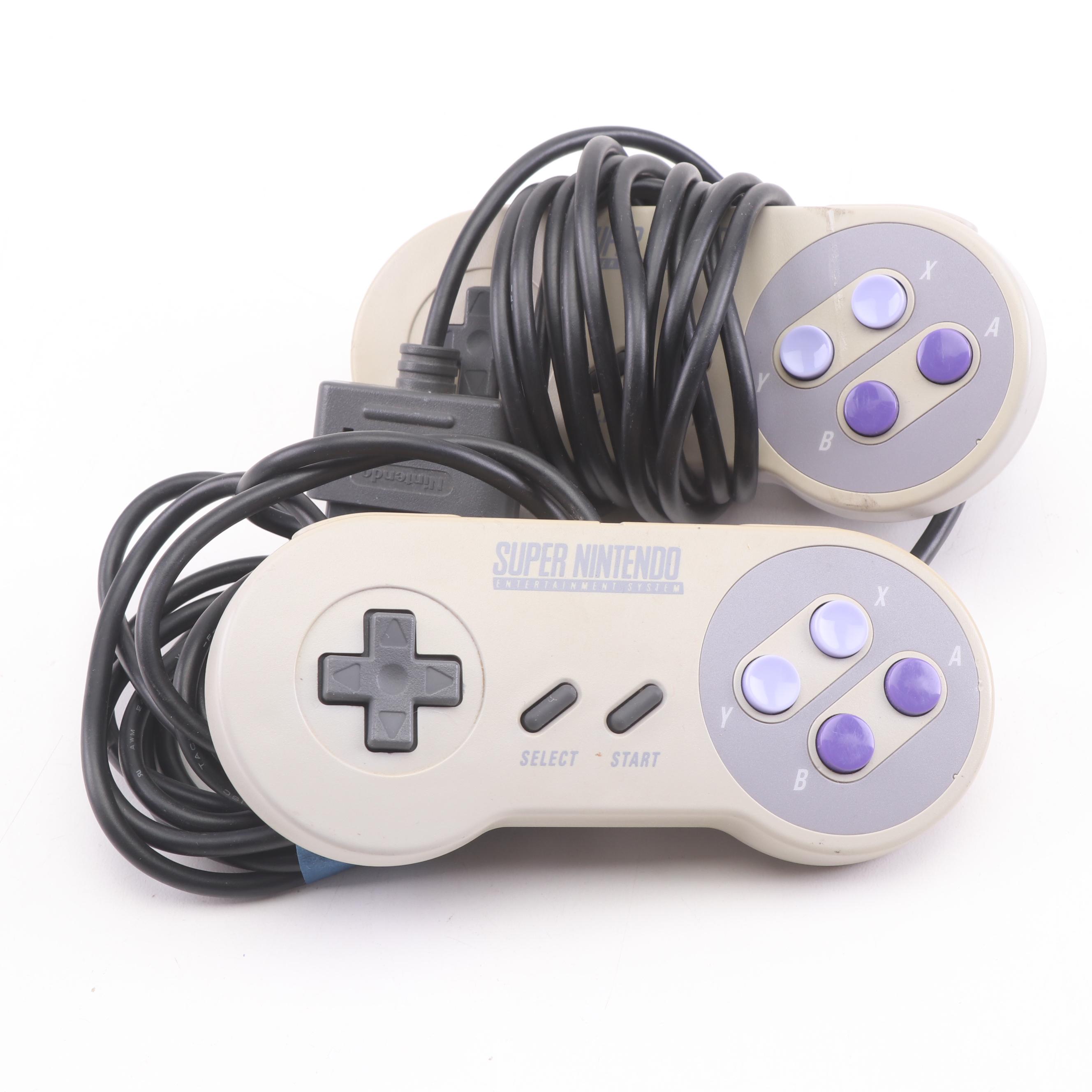 Super Nintendo Gaming Console Model SNS-001 and Game Cartridges