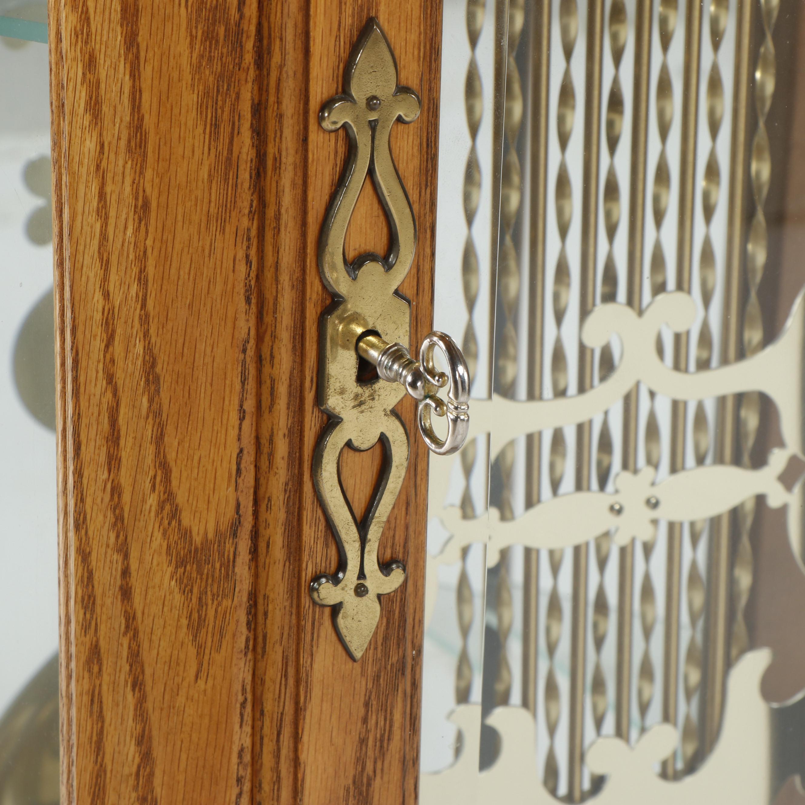 Howard Miller "Majestic" Oak Curio Cabinet Clock