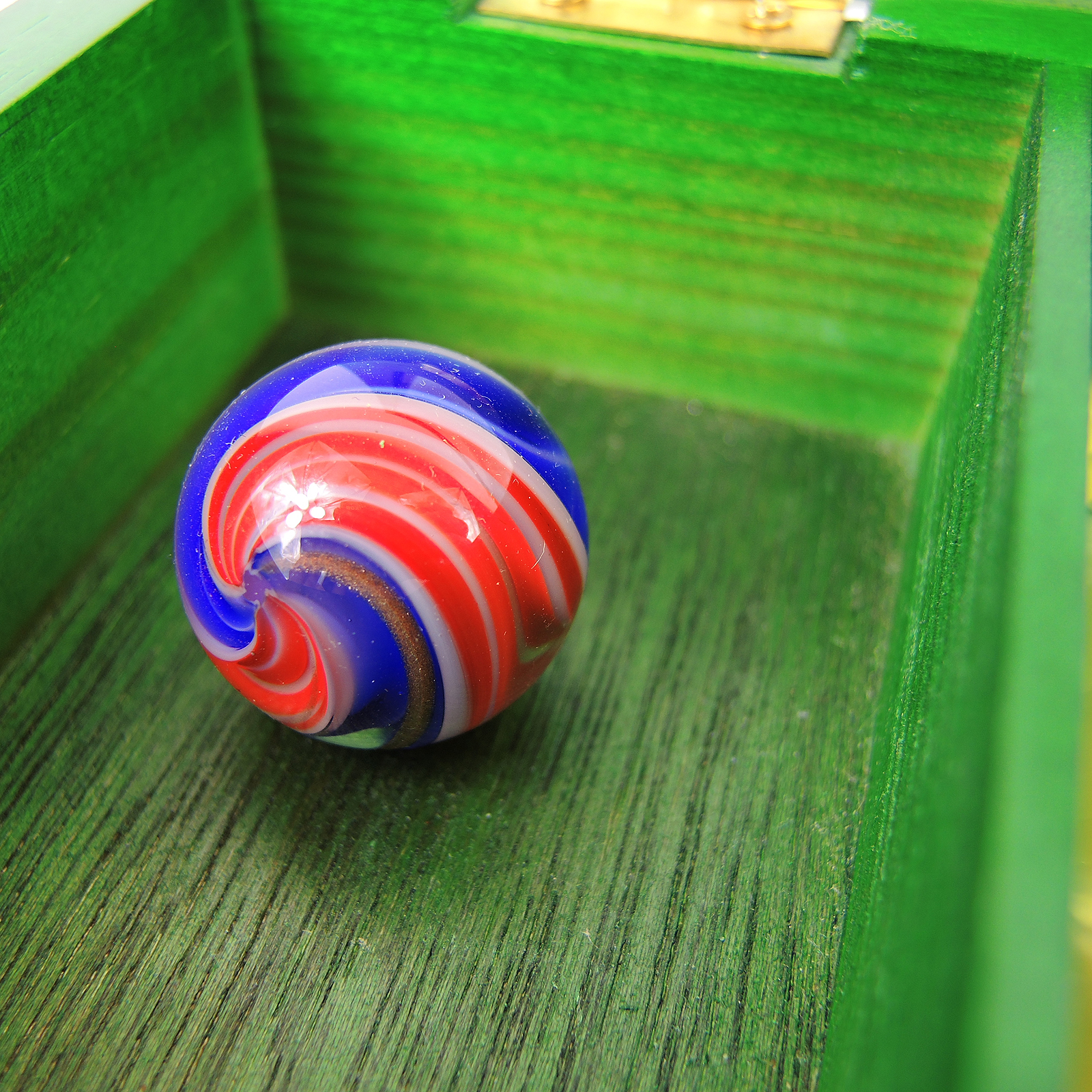 Glass and Clay Marbles with Corkscrews and Large Peppermint in Display
