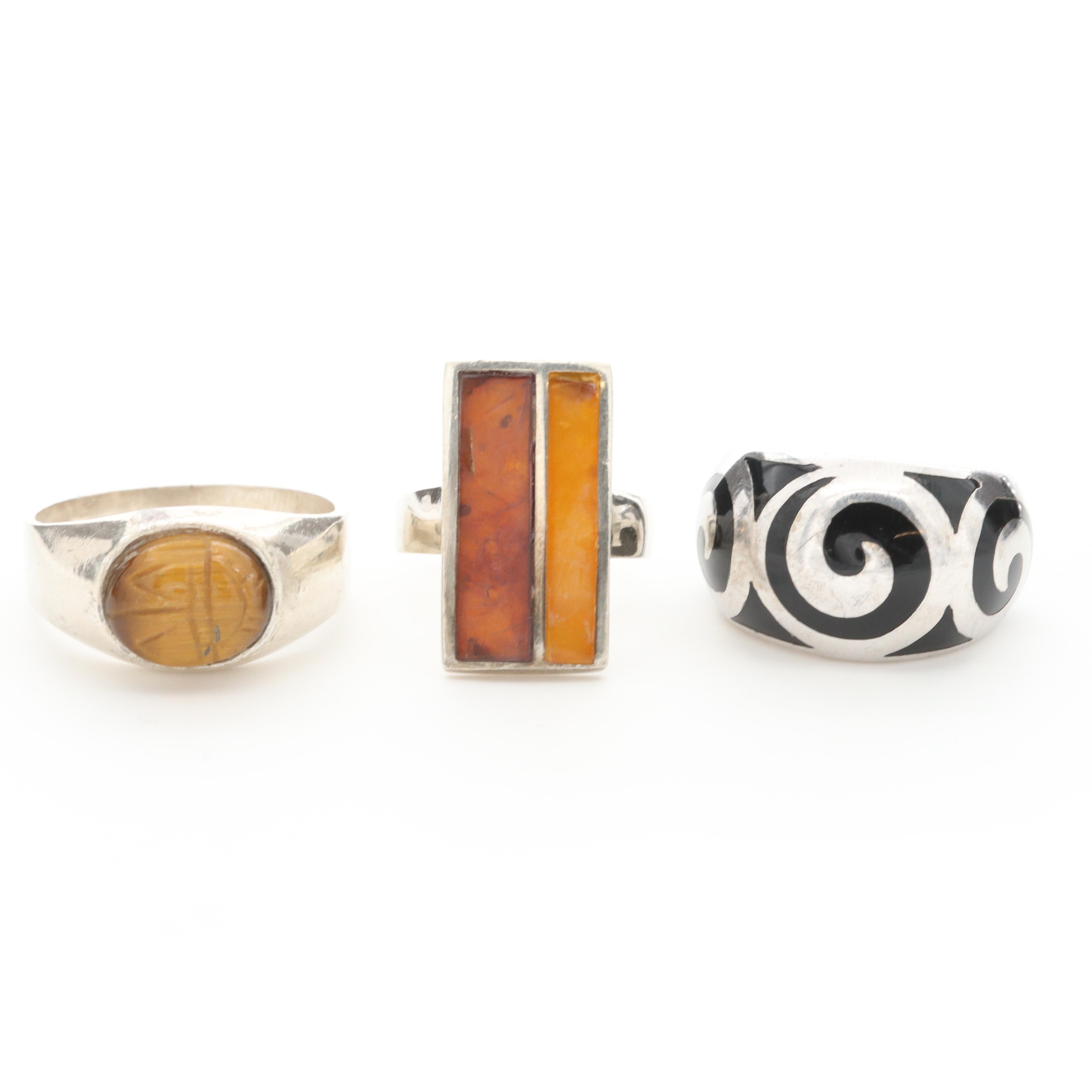 Collection of Sterling Silver Tiger's Eye, Enamel and Copal Rings