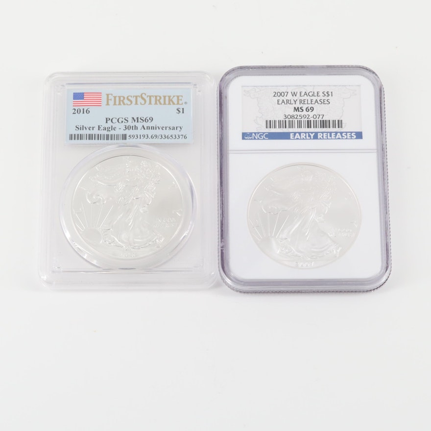 Two Graded One Dollar U.S. Silver Eagles