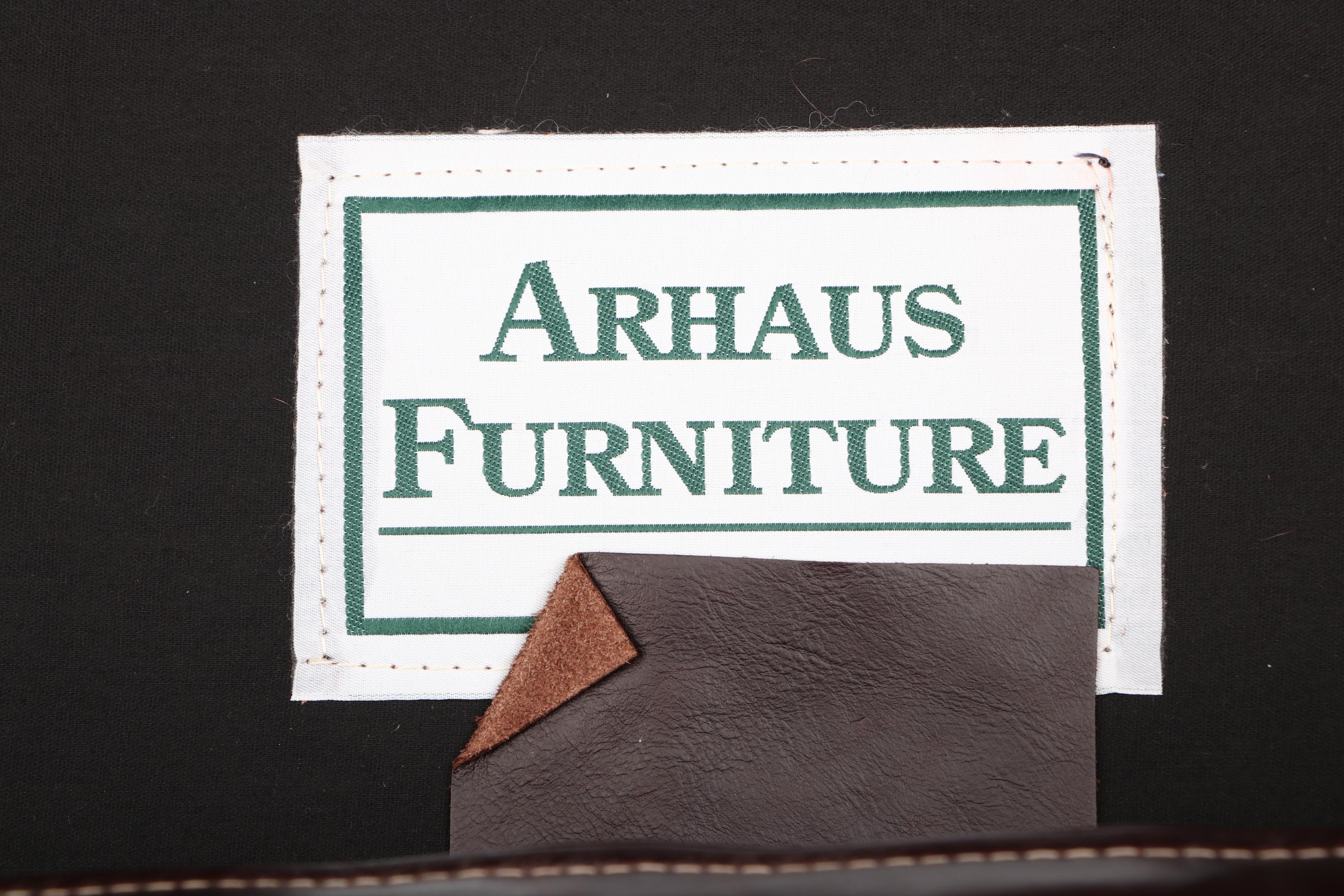 Arhaus Furniture, "Alex" Brown Leather Armchair and Ottoman