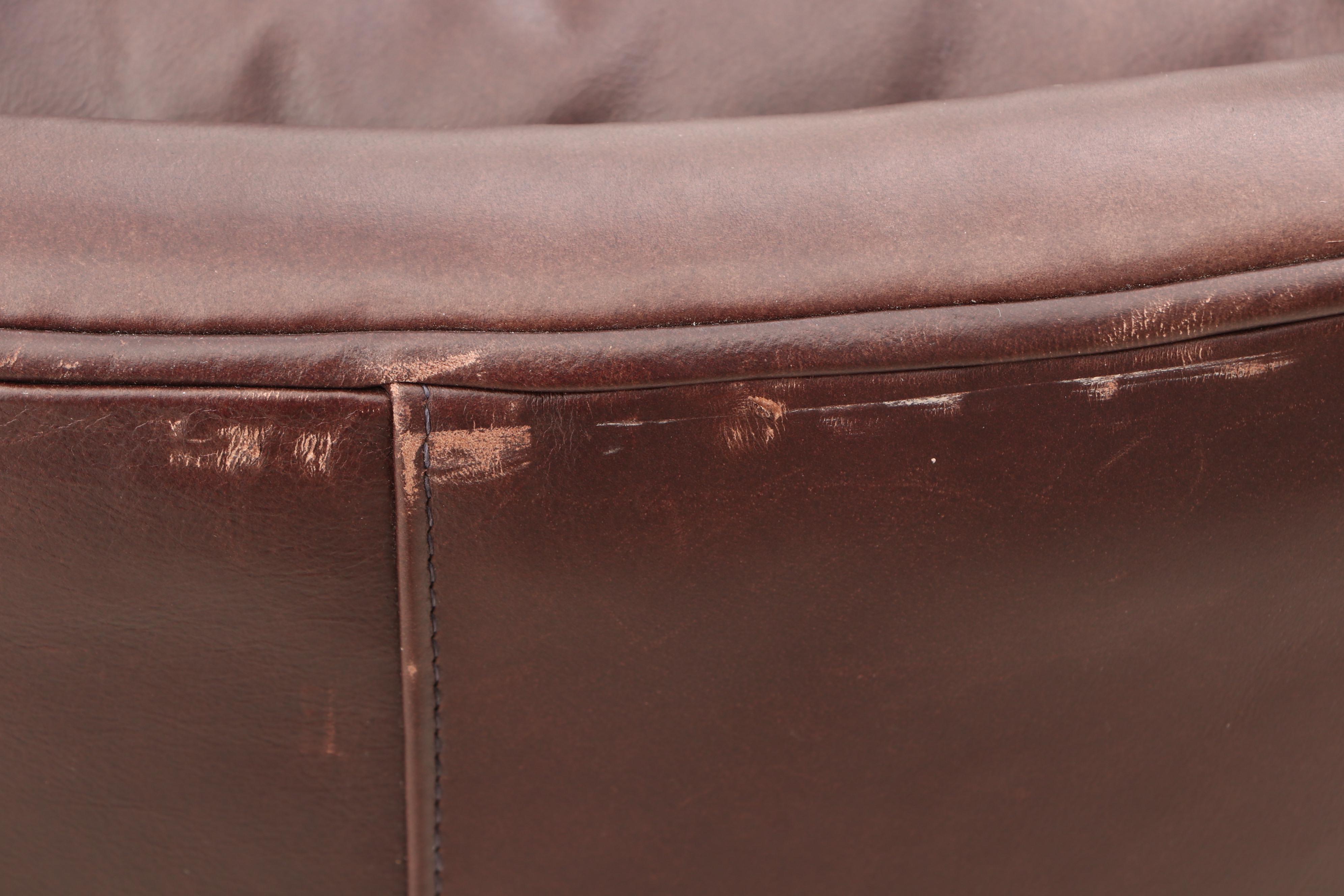 Arhaus Furniture, "Alex" Brown Leather Armchair and Ottoman