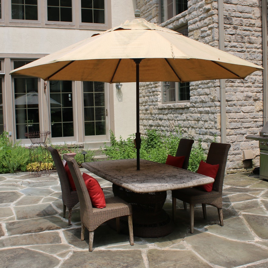 Frontgate Stone Top Table and Wicker Pedestal with Four Chairs and Umbrella