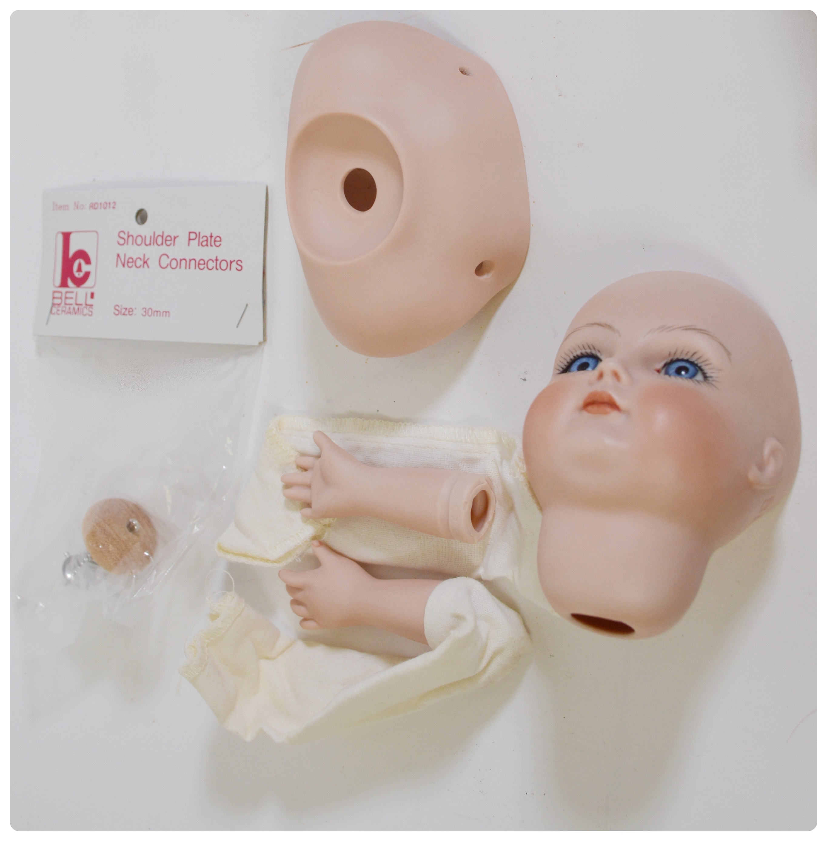 Vintage Porcelain Dolls and Doll Parts Including Bell Ceramics, Inc.