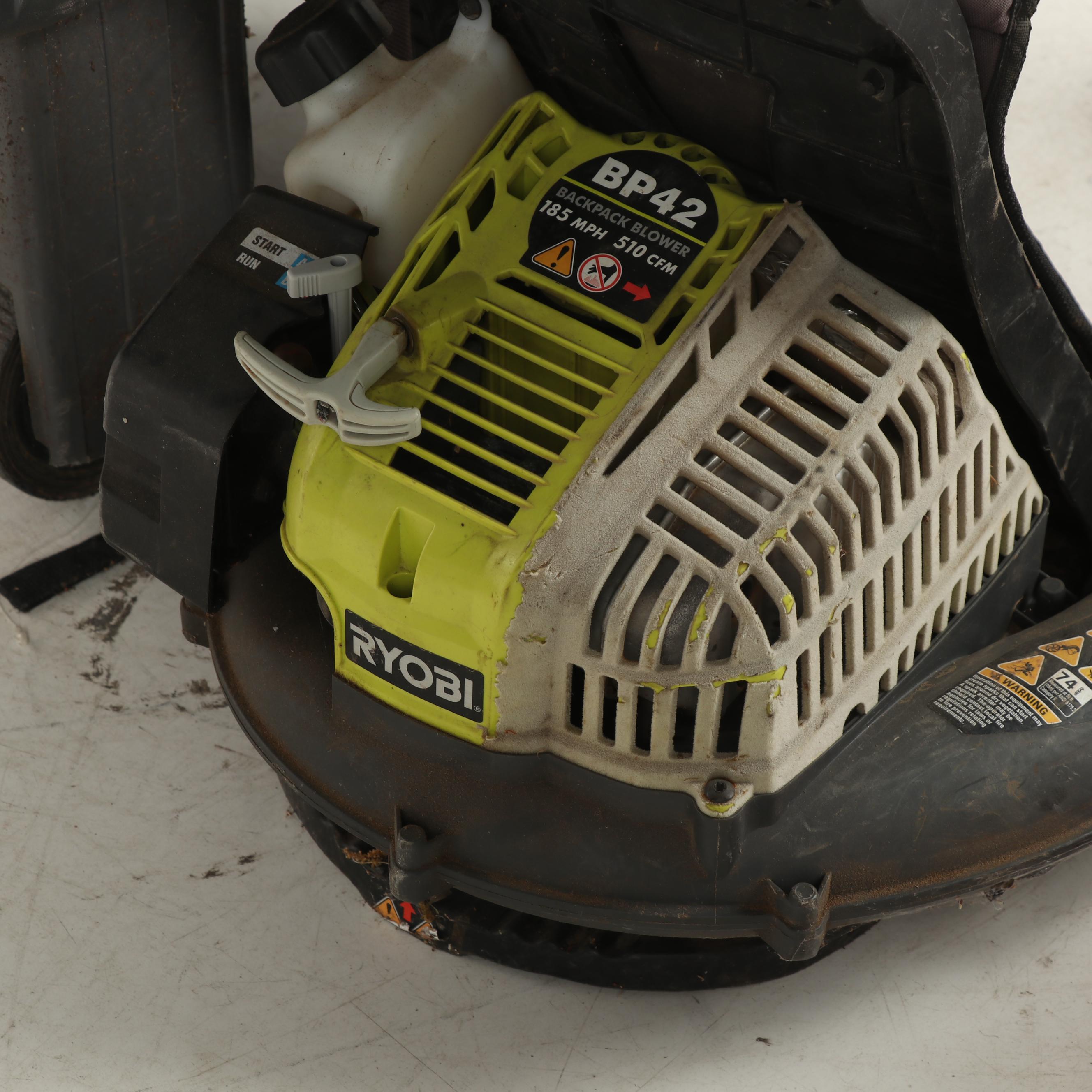 True Temper Wheel Barrow with Chainsaw and Leaf Blower