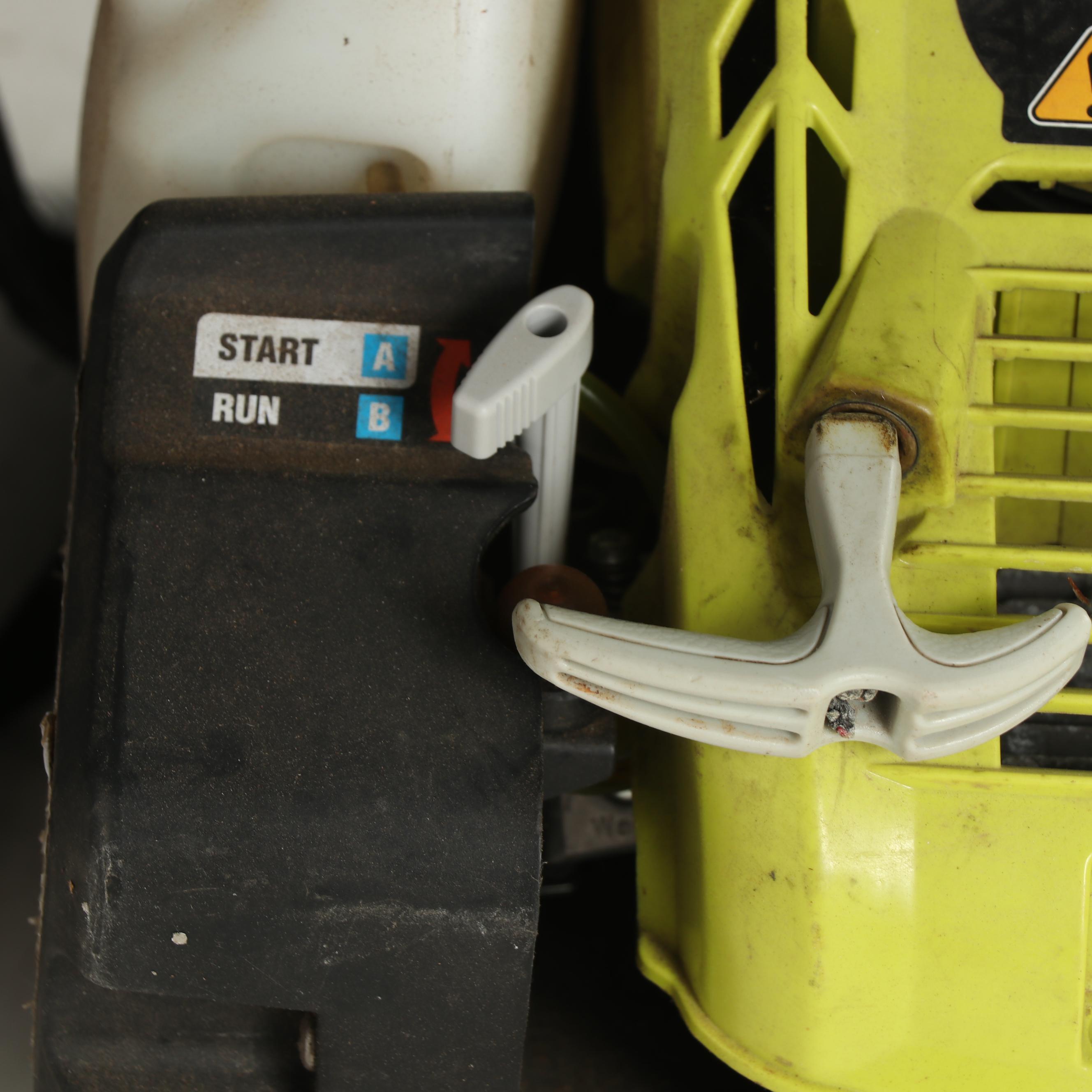 True Temper Wheel Barrow with Chainsaw and Leaf Blower