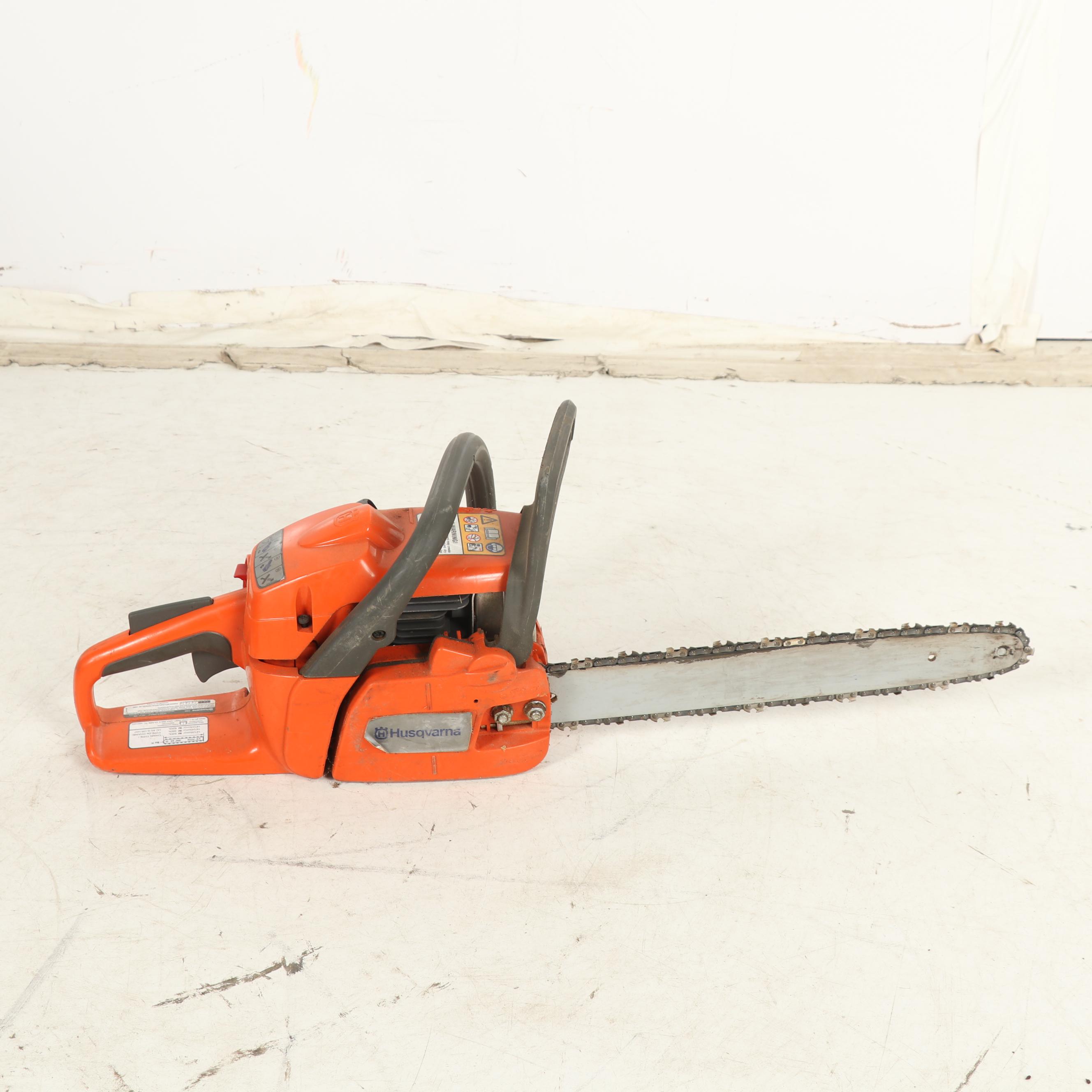 True Temper Wheel Barrow with Chainsaw and Leaf Blower