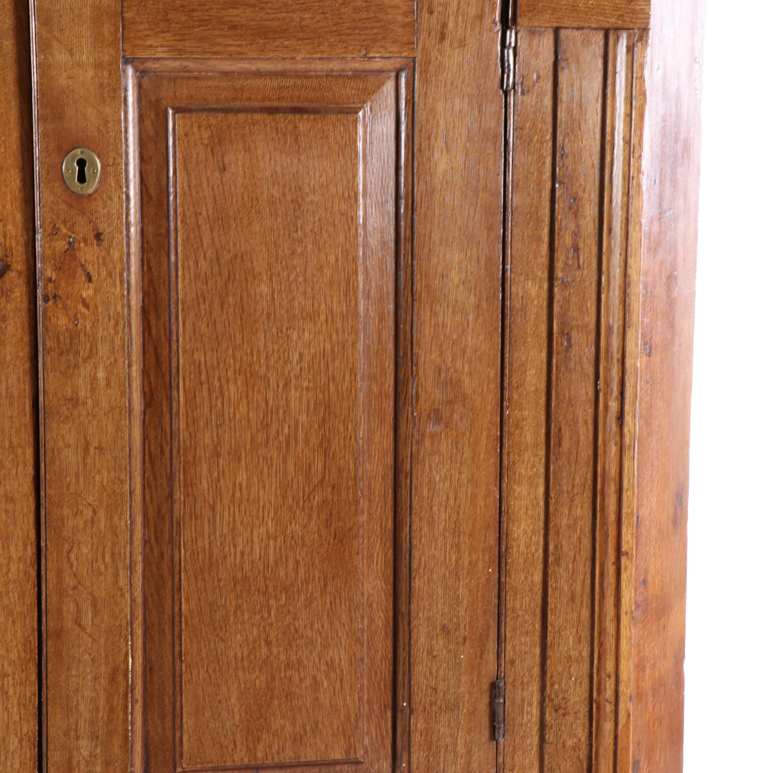 George III Provincial Oak Corner Cupboard with Architectural Interior, 19th C.