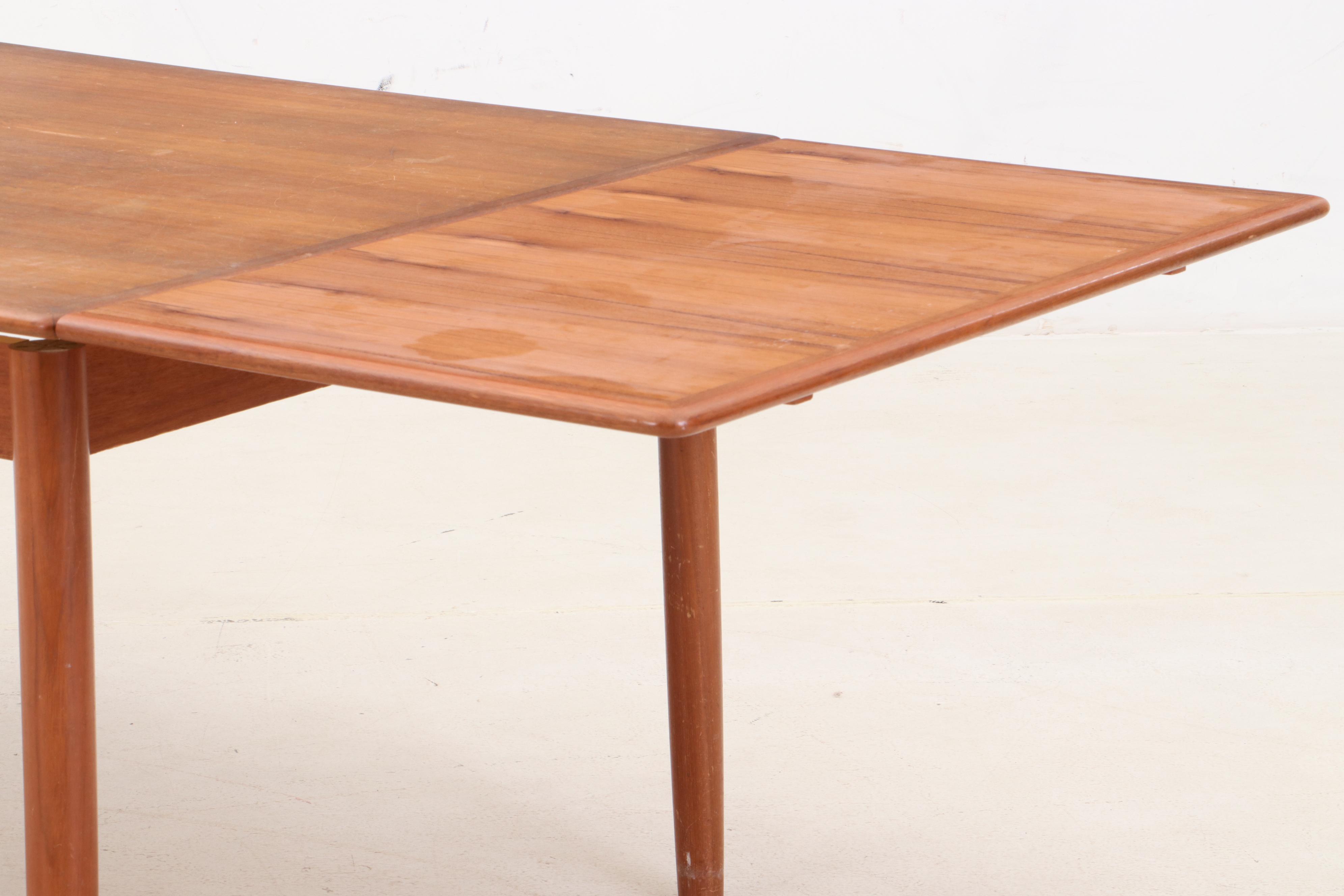 Danish Modern Teak Draw Leaf Dining Table and Chairs