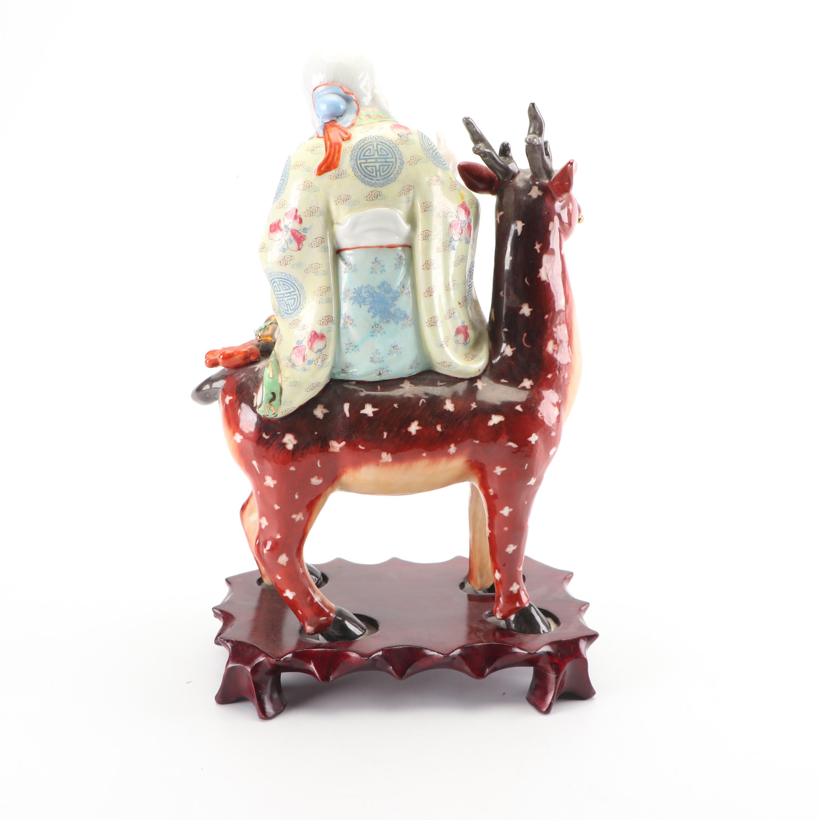 Chinese God of Longevity Riding a Deer Ceramic Figurine on Wooden Base