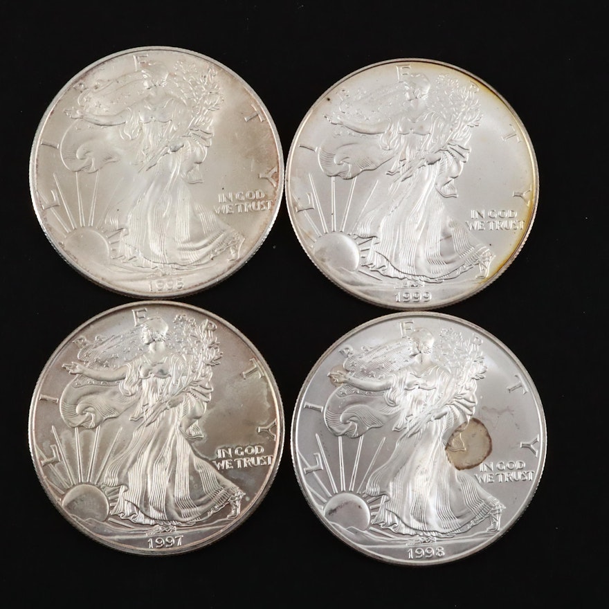 Four One Dollar U.S. Silver Eagles Featuring a 1995 and 1999