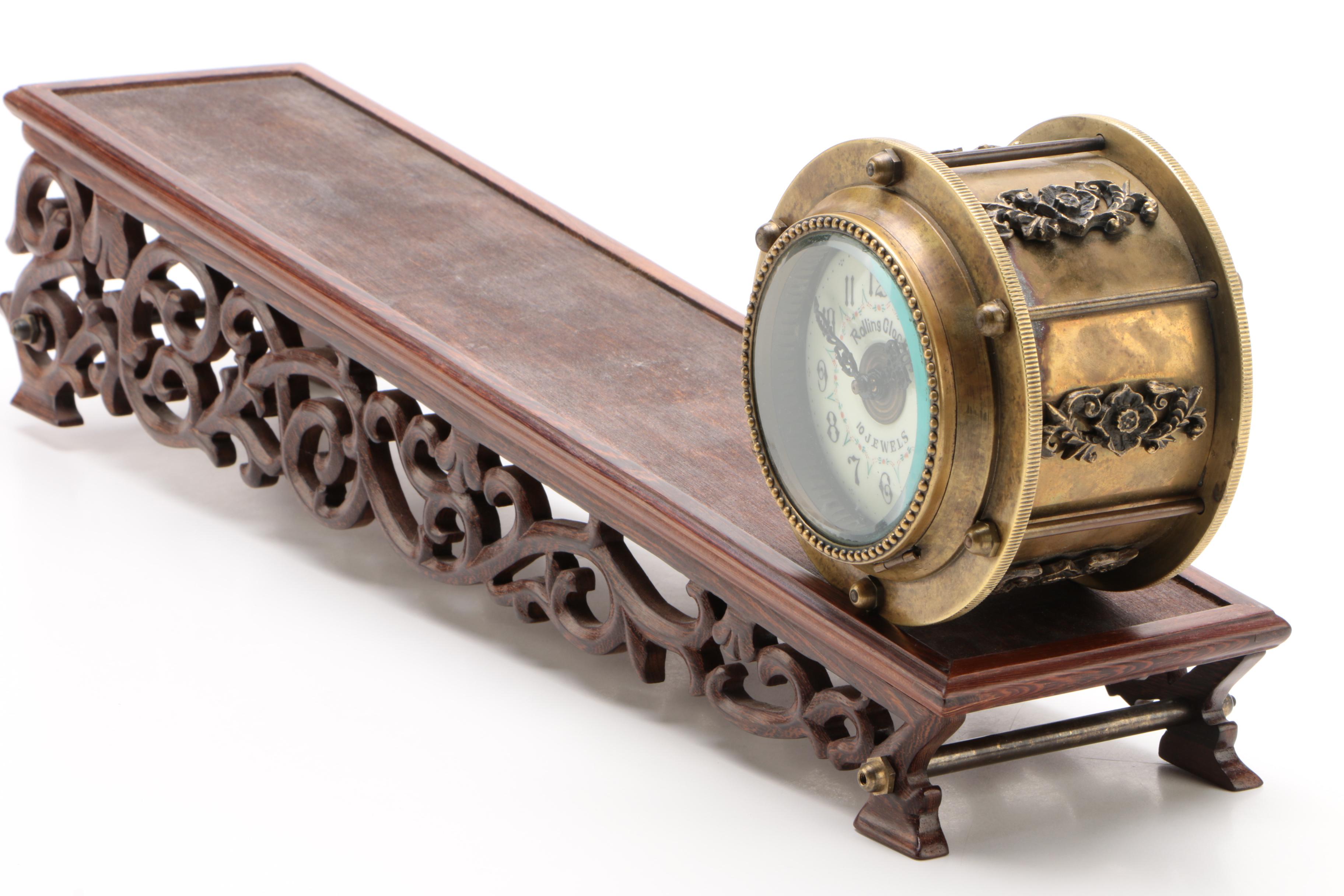 10 Jewel Rolling Drum Incline Plane Clock With Reticulated Carved Wood Base
