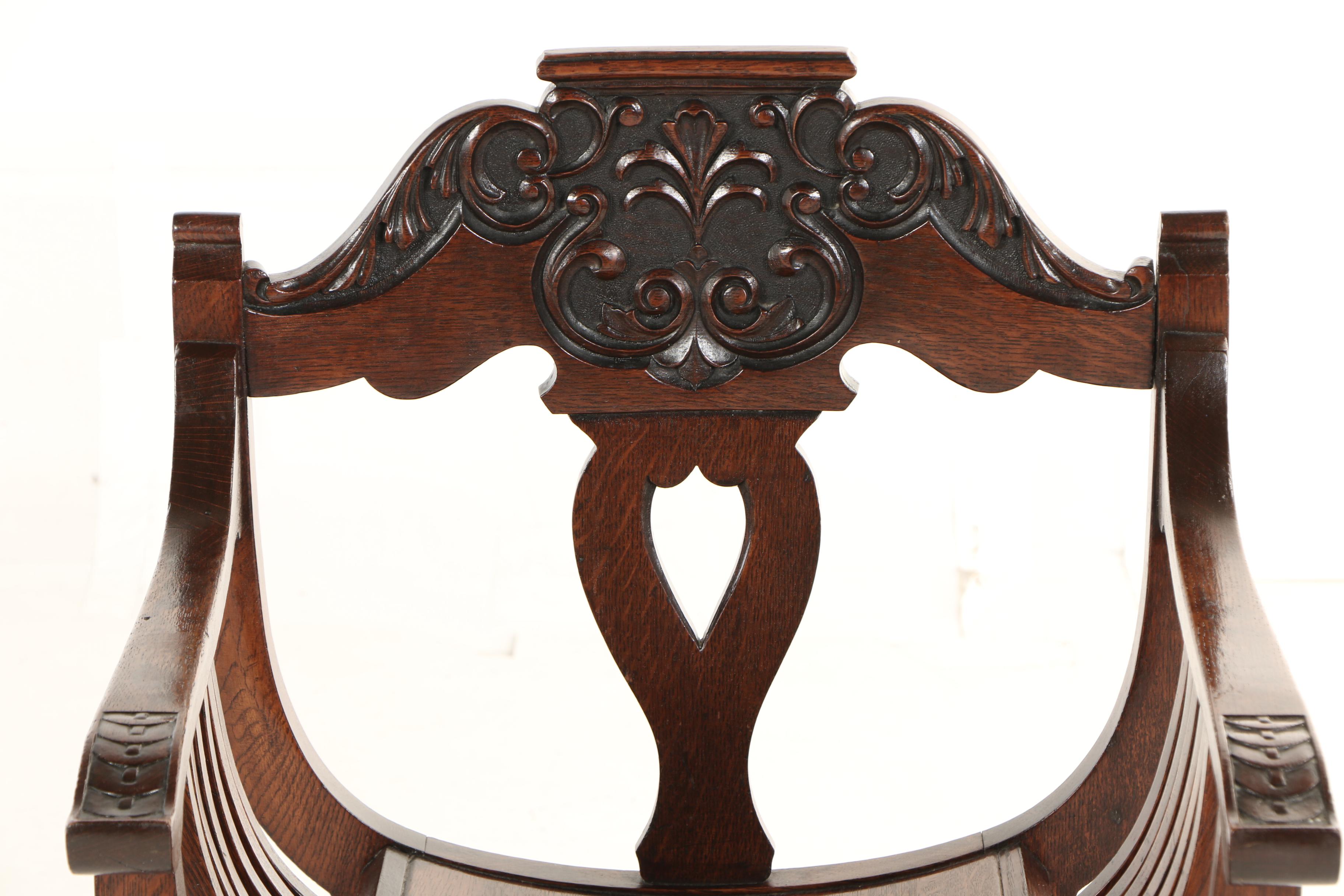 The Stomps Burkhardt Co., Late Victorian Carved Oak Savonarola Chair