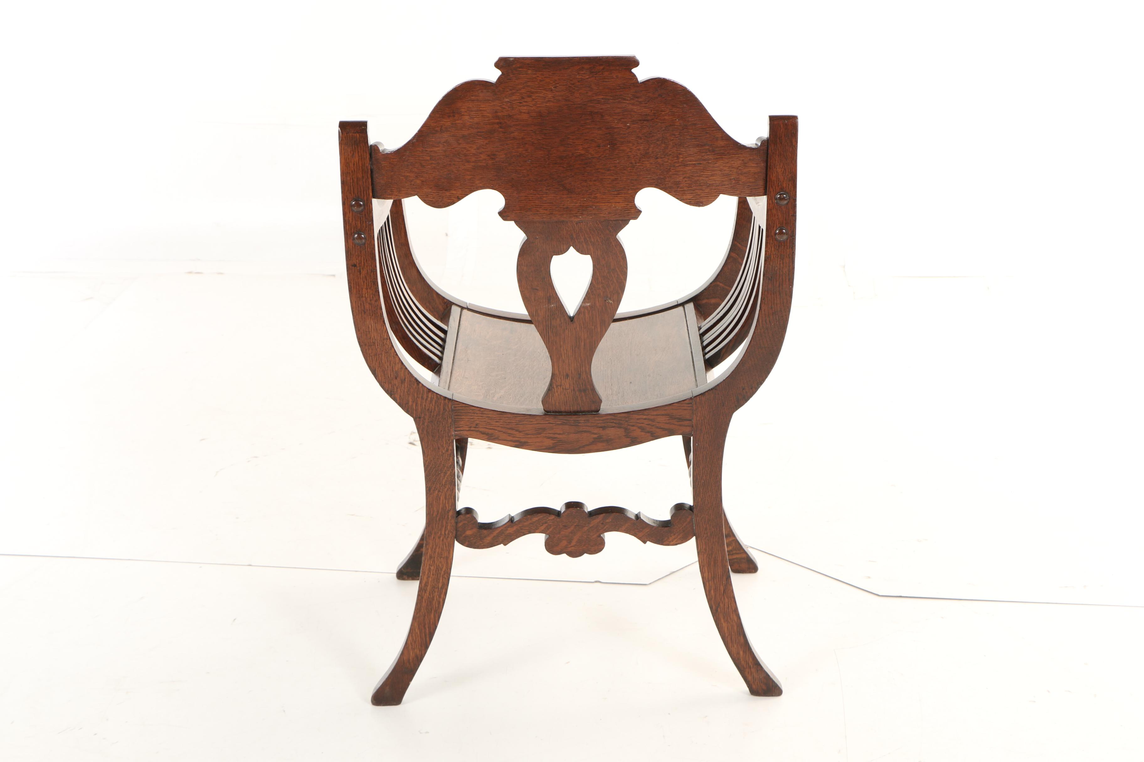 The Stomps Burkhardt Co., Late Victorian Carved Oak Savonarola Chair