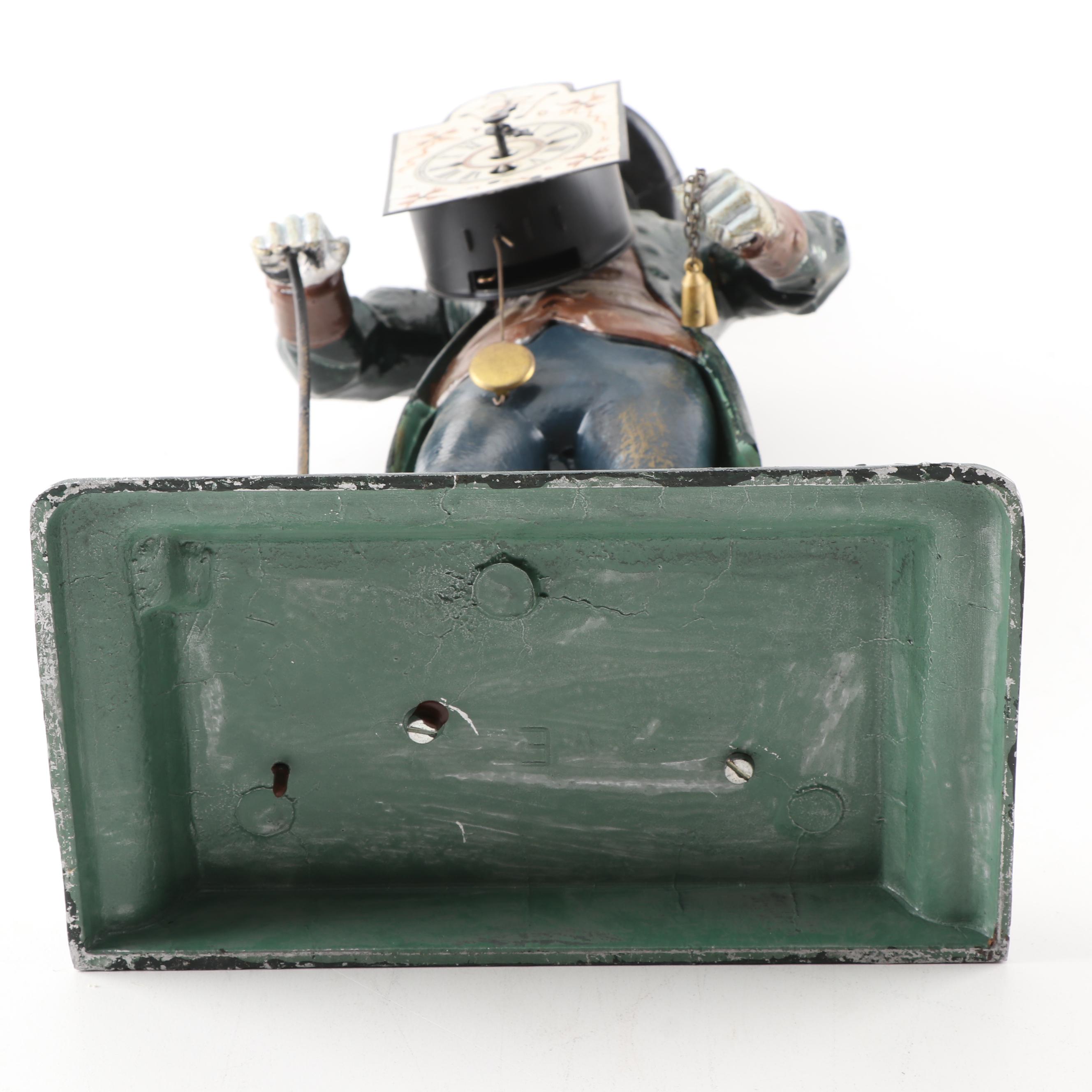 J.v.E. Cast Metal Dutch Clock Peddler Figural Clock, Early to Mid 20th Century