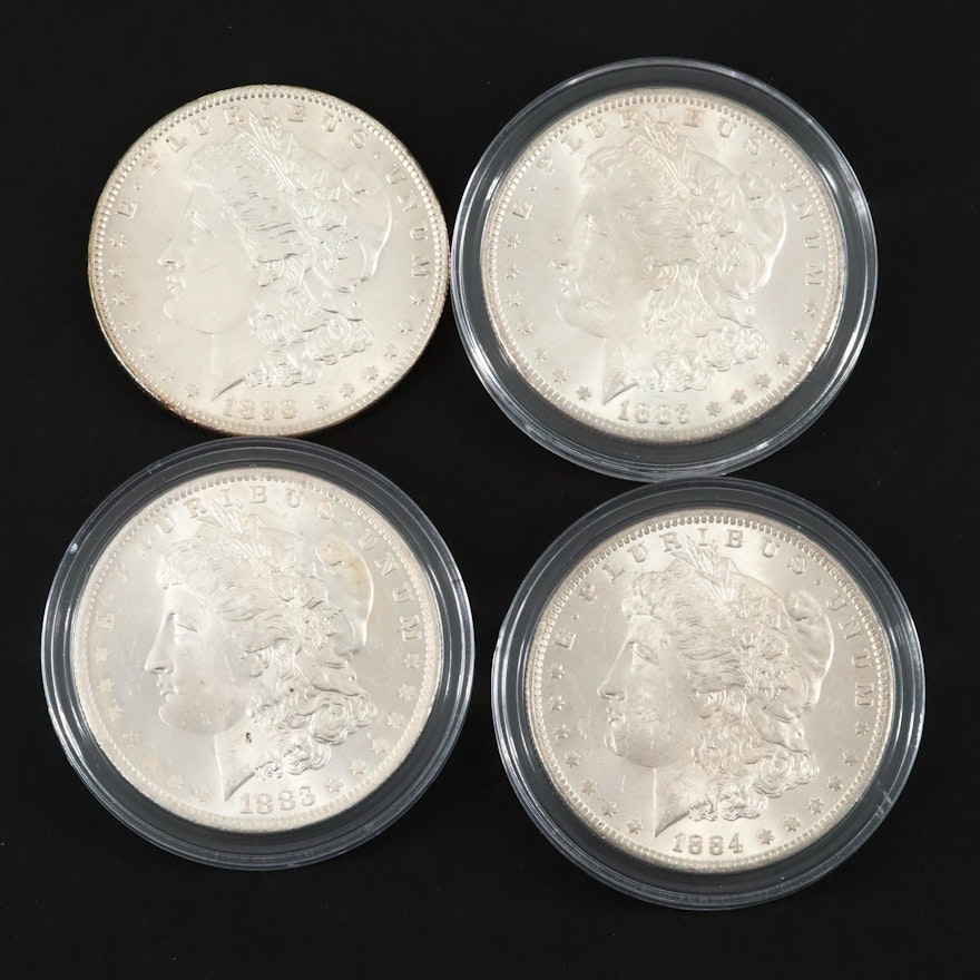 Four Silver Morgan Dollars Including an 1883-O and 1898