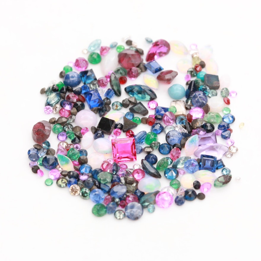 Loose 14.50 CTW Assorted Gemstones Including Opal, Garnet and Blue Sapphire