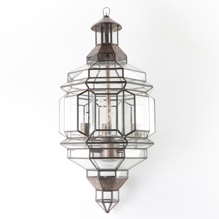 Hanging Lantern Style Light Fixture with Glass Panels and Stamped Metal Accents