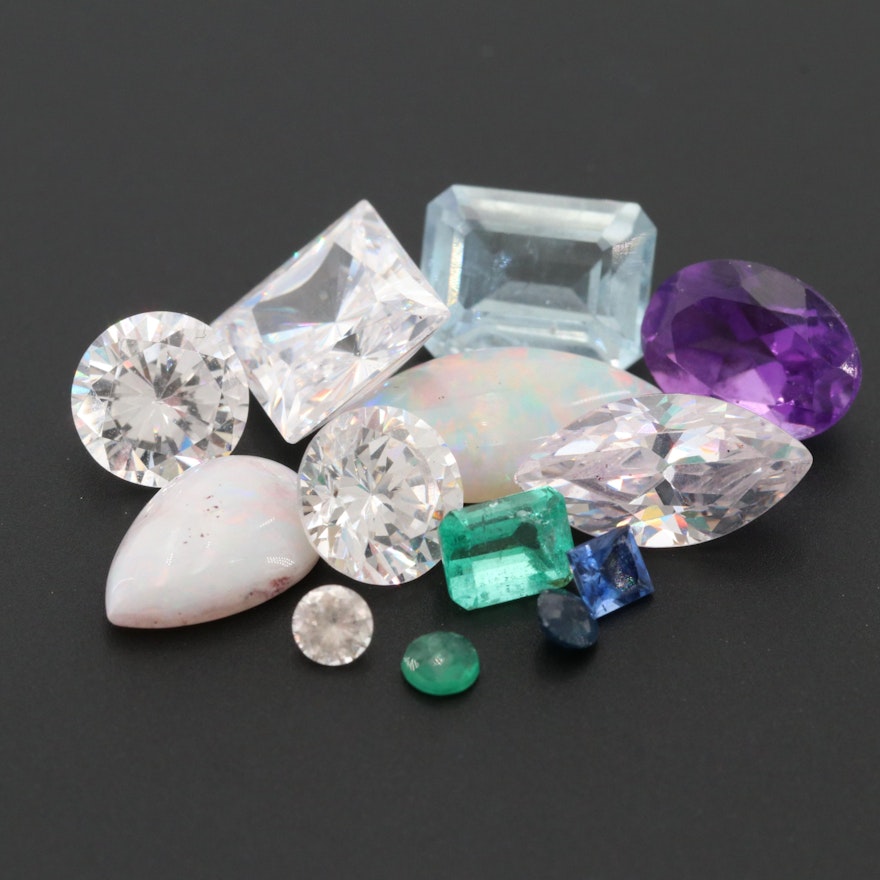 Loose 13.02 CTW Gemstone Assortment Including Topaz and Emerald