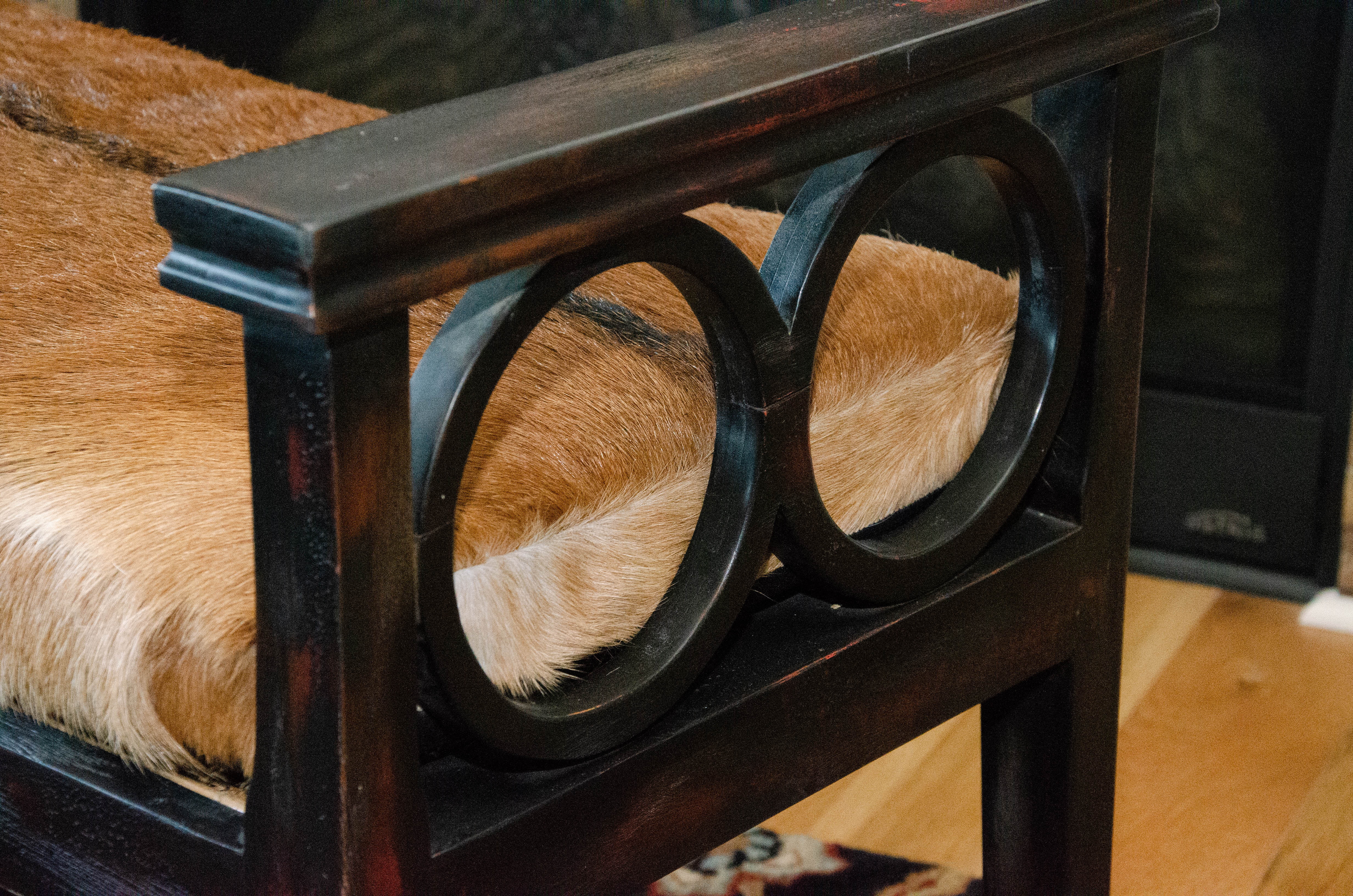 Contemporary Wood Bench with Cane Seating and Bovine Fur Upholstered Seat
