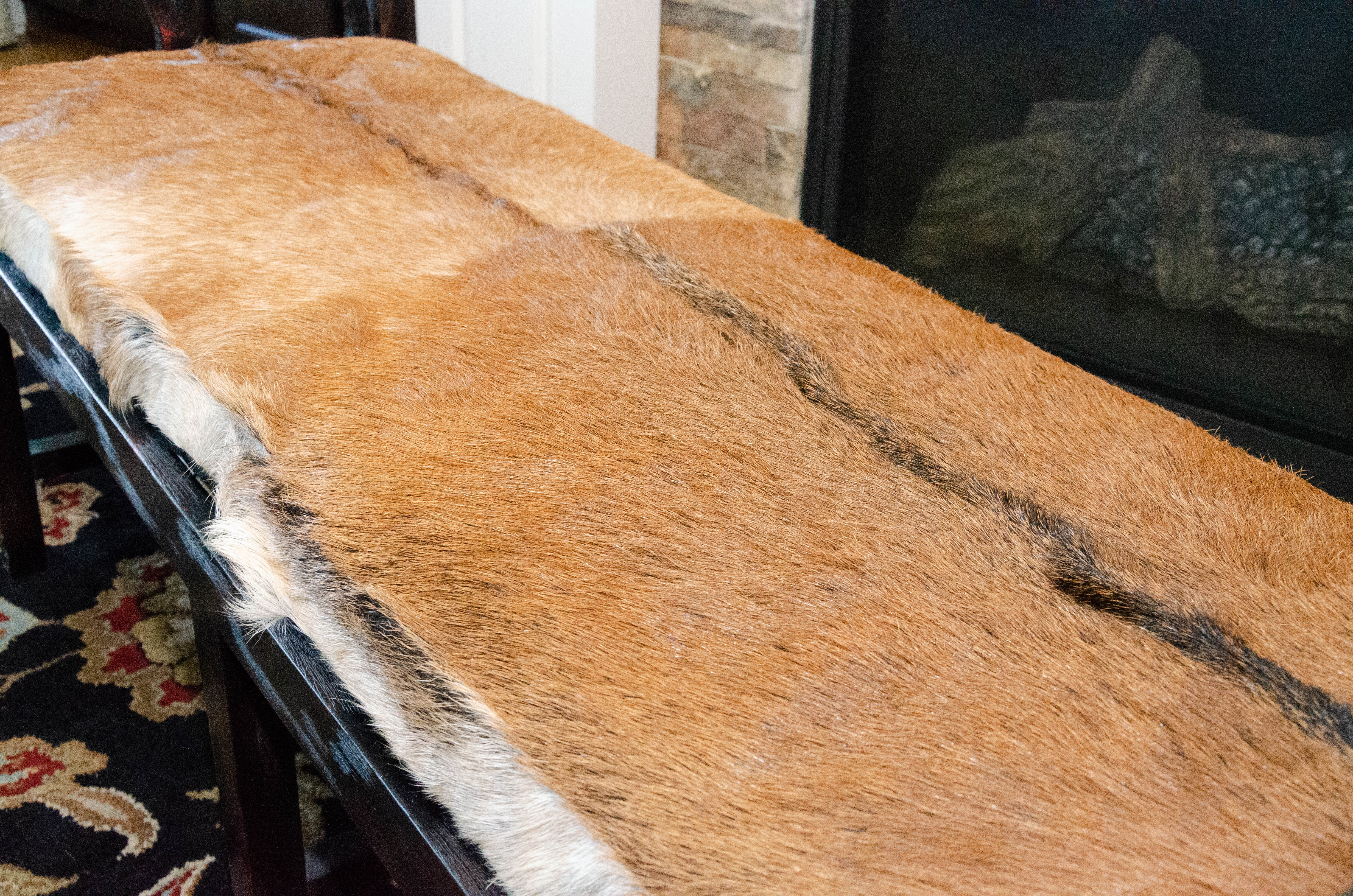 Contemporary Wood Bench with Cane Seating and Bovine Fur Upholstered Seat