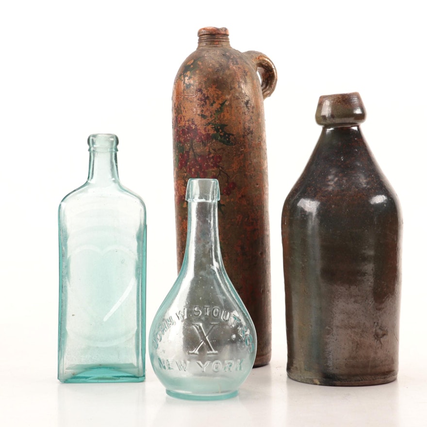 American Folk Art Painted Stoneware Jug with other Antique Bottles, 19th Century