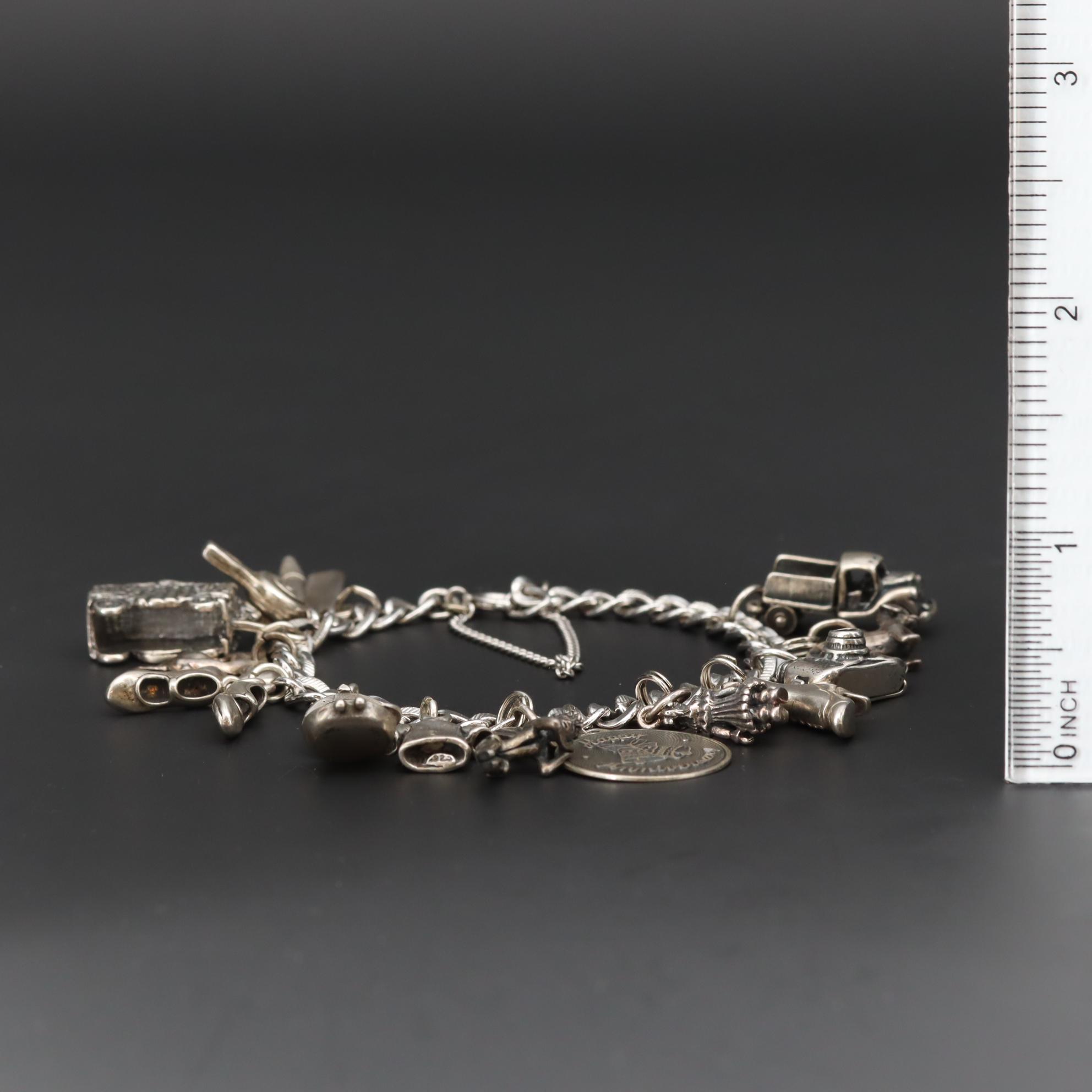Charm Bracelet With Sterling Silver Charms Including Fairy and Circus Cart