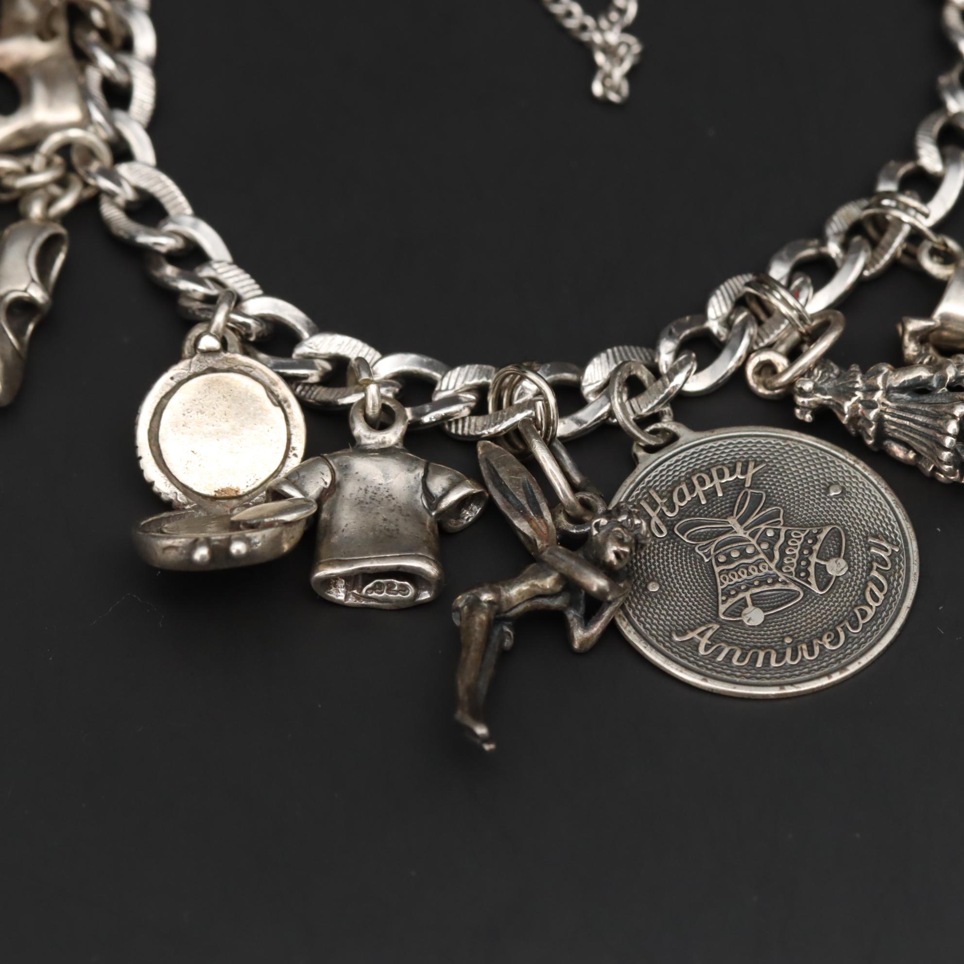 Charm Bracelet With Sterling Silver Charms Including Fairy and Circus Cart