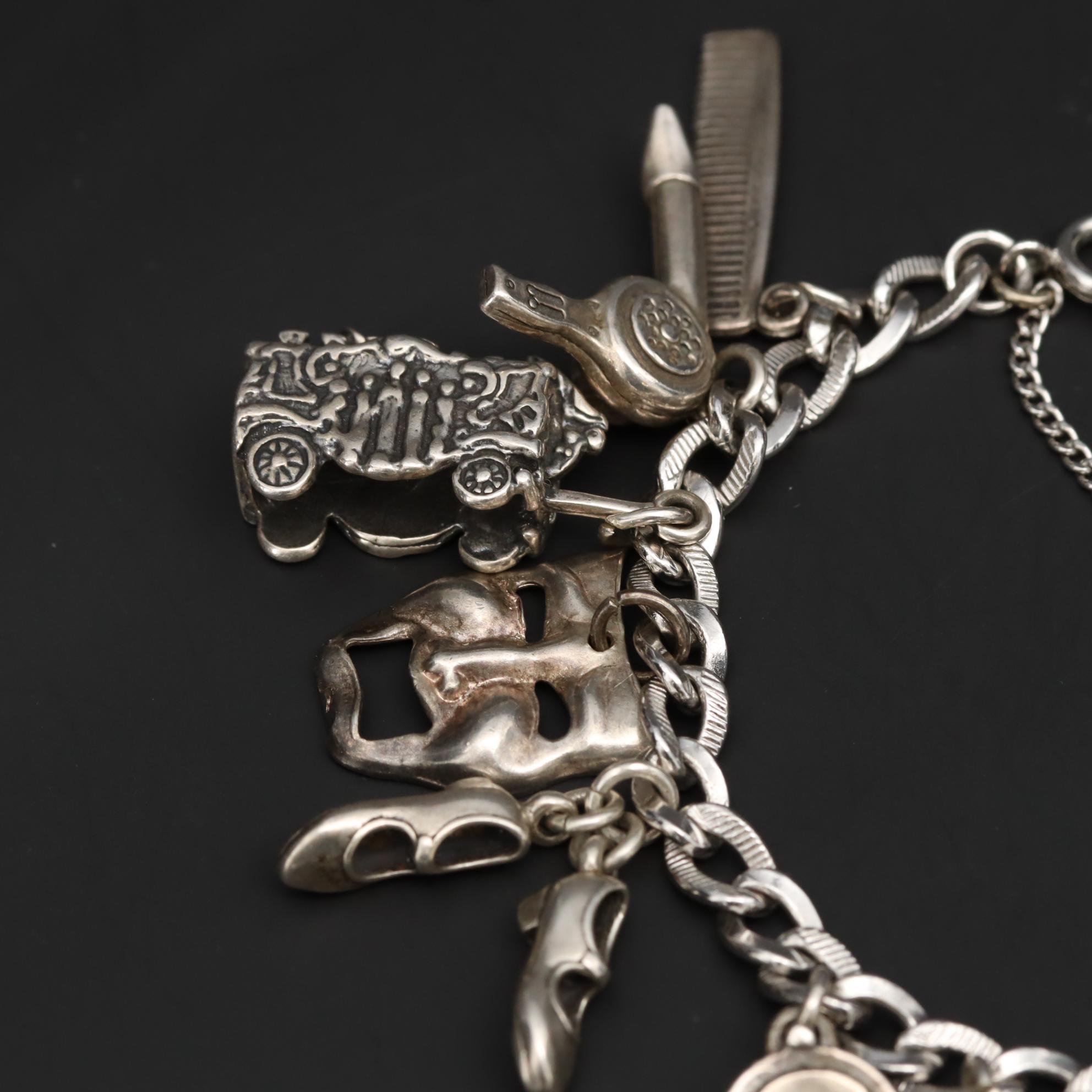 Charm Bracelet With Sterling Silver Charms Including Fairy and Circus Cart