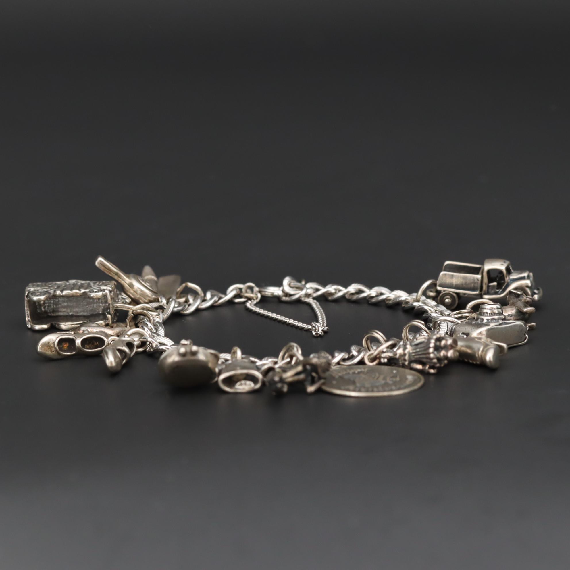 Charm Bracelet With Sterling Silver Charms Including Fairy and Circus Cart
