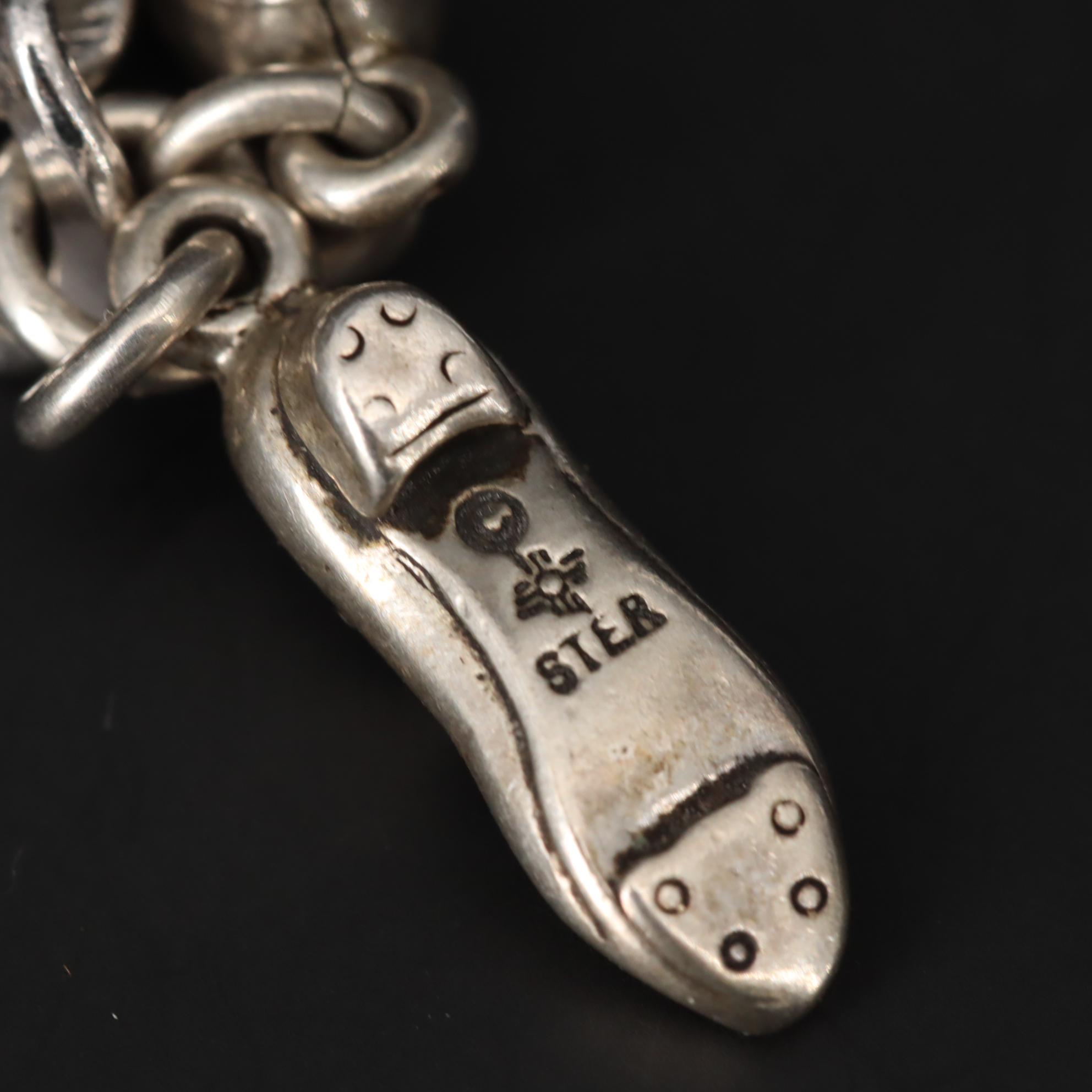 Charm Bracelet With Sterling Silver Charms Including Fairy and Circus Cart