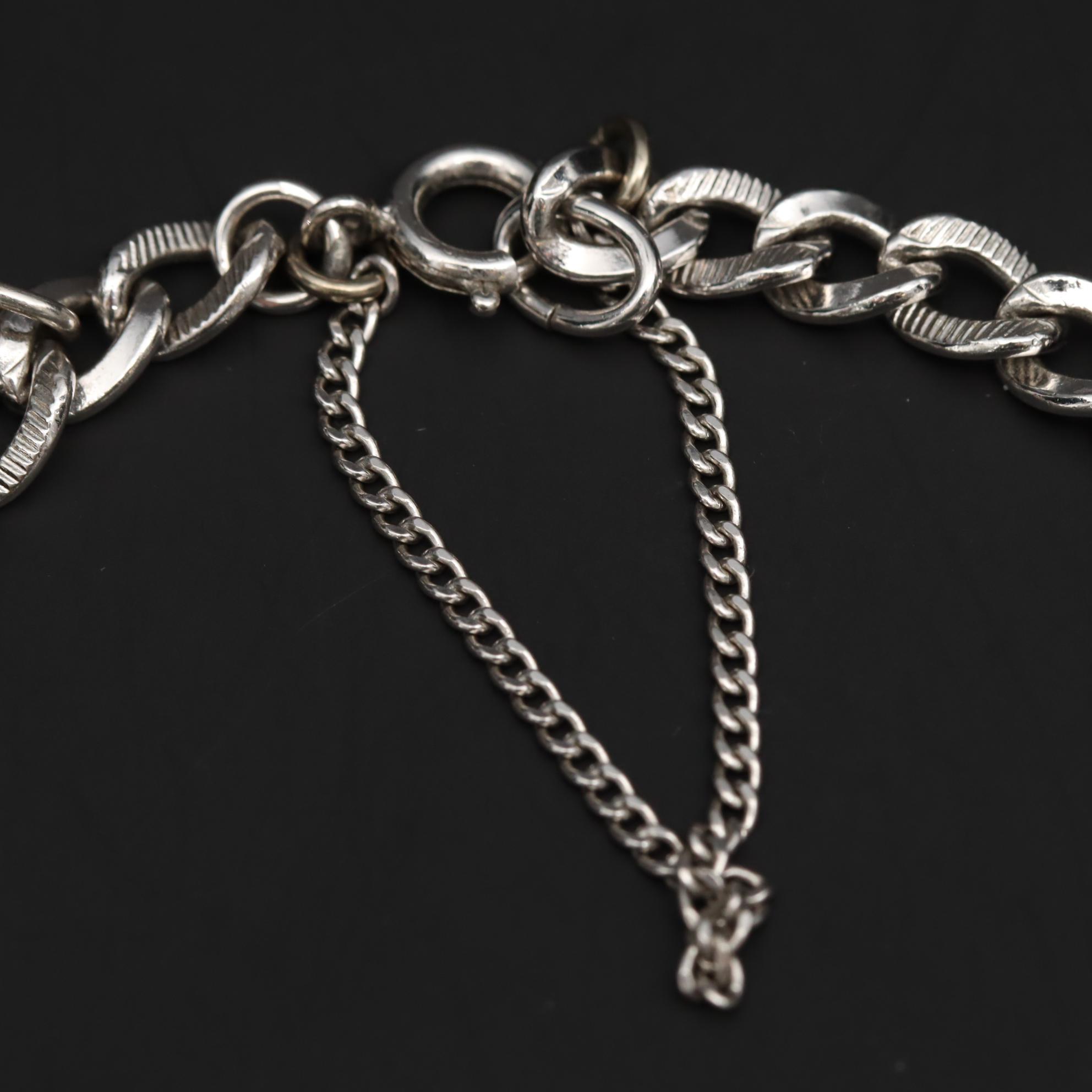 Charm Bracelet With Sterling Silver Charms Including Fairy and Circus Cart