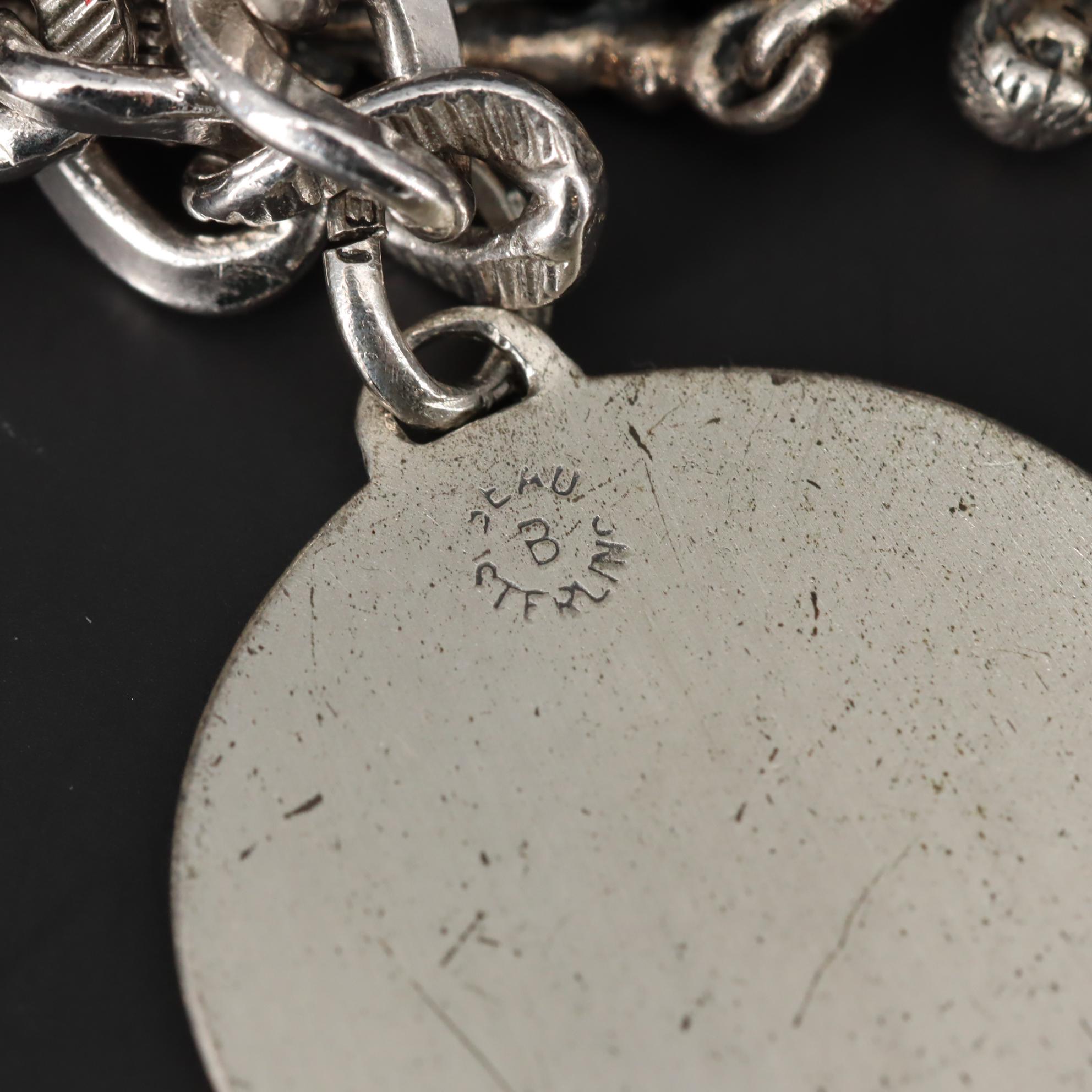 Charm Bracelet With Sterling Silver Charms Including Fairy and Circus Cart